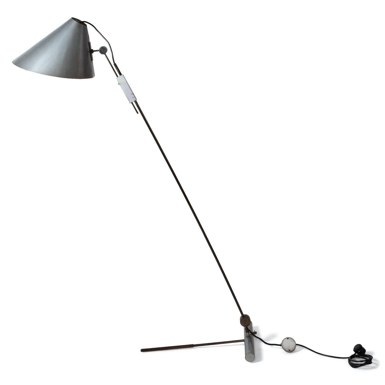 Floor lamp by Tito Agnoli (1931-2012) on cylindrical T-shaped base with slender brass shaft and tilting grey conical lampshade. Designed for O-Luce in 1954.
Lit: Domus n. 314, Una Selezione di Gusto per la Casa, January 1956, p. 53, fig. 21.
For