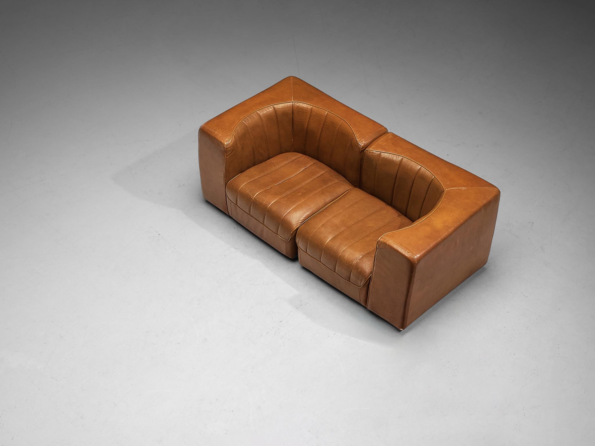 Tito Agnoli for Arflex, two seat sofa, model '9000', leather, wood, Italy, 1969

This design is characterized by a cubic outer frame that provides a visually interesting contrast to the round seat. When seated you experience a pleasant enclosed