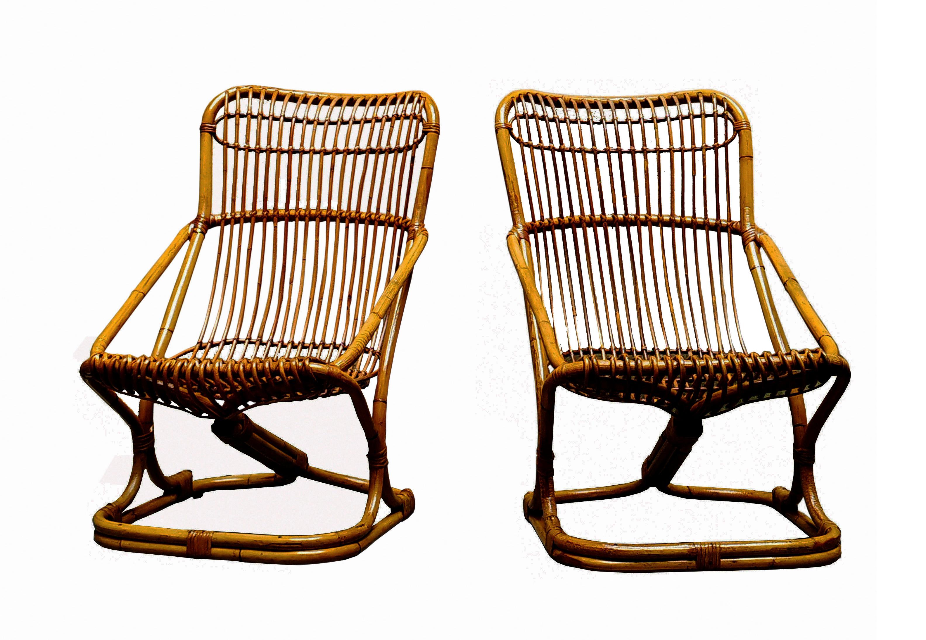 Elegant pair of 1960s malacca armchairs designed by Tito Agnoli. Tito Agnoli was born in Lima to an Italian family; first an architect then a designer, he collaborated with numerous Italian companies, including Bonacina1889. Some of his pieces are