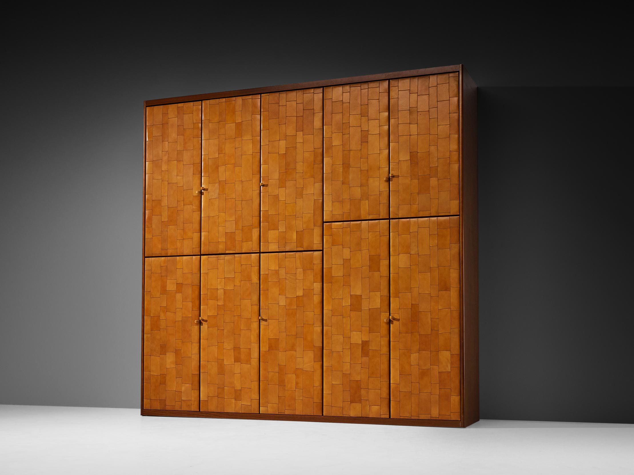 Tito Agnoli for Caleido/Poltrona Frau wardrobe, patchwork cognac leather, stained birch, metal, Italy, 1970s.

This is an eye-catching and rare wardrobe that is designed by Tito Agnoli for Caleido, another company by Poltrona Frau. This piece is