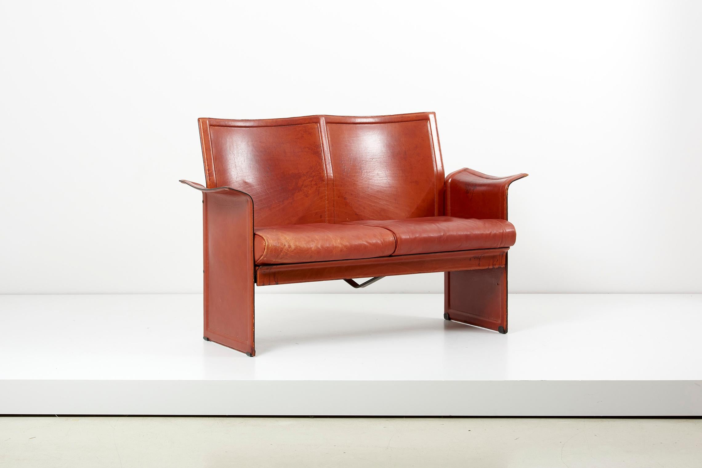 Tito Agnoli for Matteo Grassi loveseat and chair in dark cognac leather, Italy
Leather Armchair Korium Tito Agnoli for Matteo Grassi and matching loveseat with a nice authentic vintage patina.

Measures: Chair is:

Height 86 cm
Width 63 cm
Depth 55