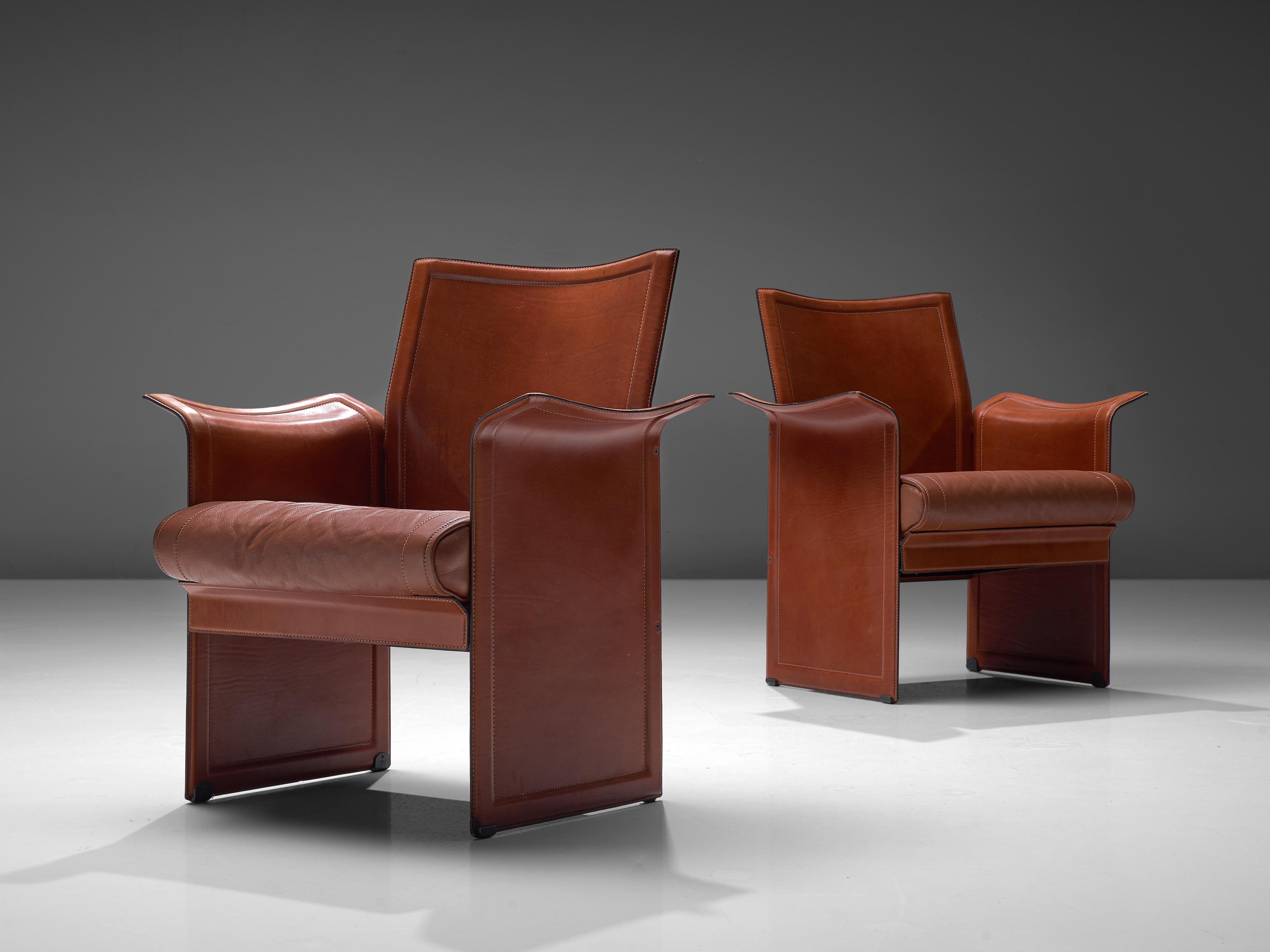 Tito Agnoli for Matteo Grassi, set of two 'Korium' chairs, leather, metal, Italy, 1970s.

These sophisticated and iconic 'Korium' leather chairs were designed by Tito Agnoli for Matteo Grassi. The design features a strong structure, with a wing