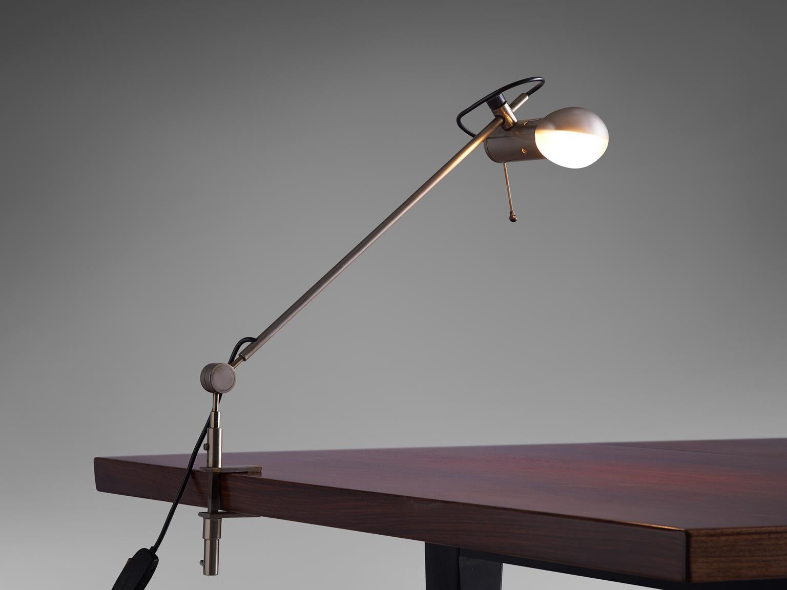 Tito Agnoli for O-Luce, desk light 'Cornalux', metal, Italy, 1964.

Modern table lamp designed by Tito Agnoli. The light bulb has a reflector inside.
A very versatile design thanks to the fixing system that can be secured to several tables, but