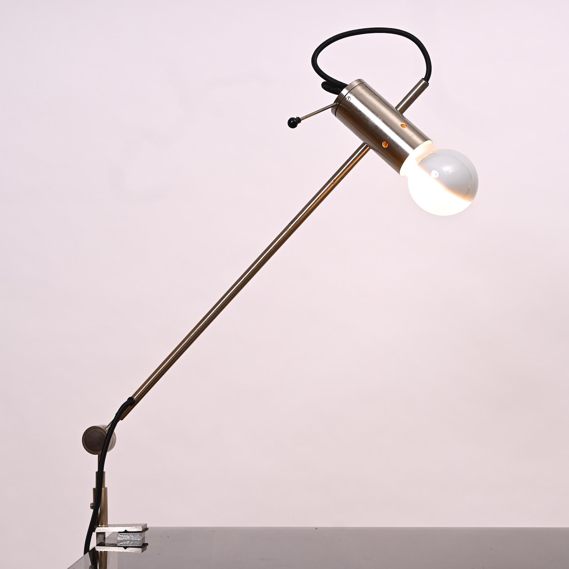 Tito Agnoli for Oluce. Italy 1954

Articulated, adjustable clamp light

Perfect minimal design. Light can be angled in any direction.

Model 255

Re wired for US and Europe.