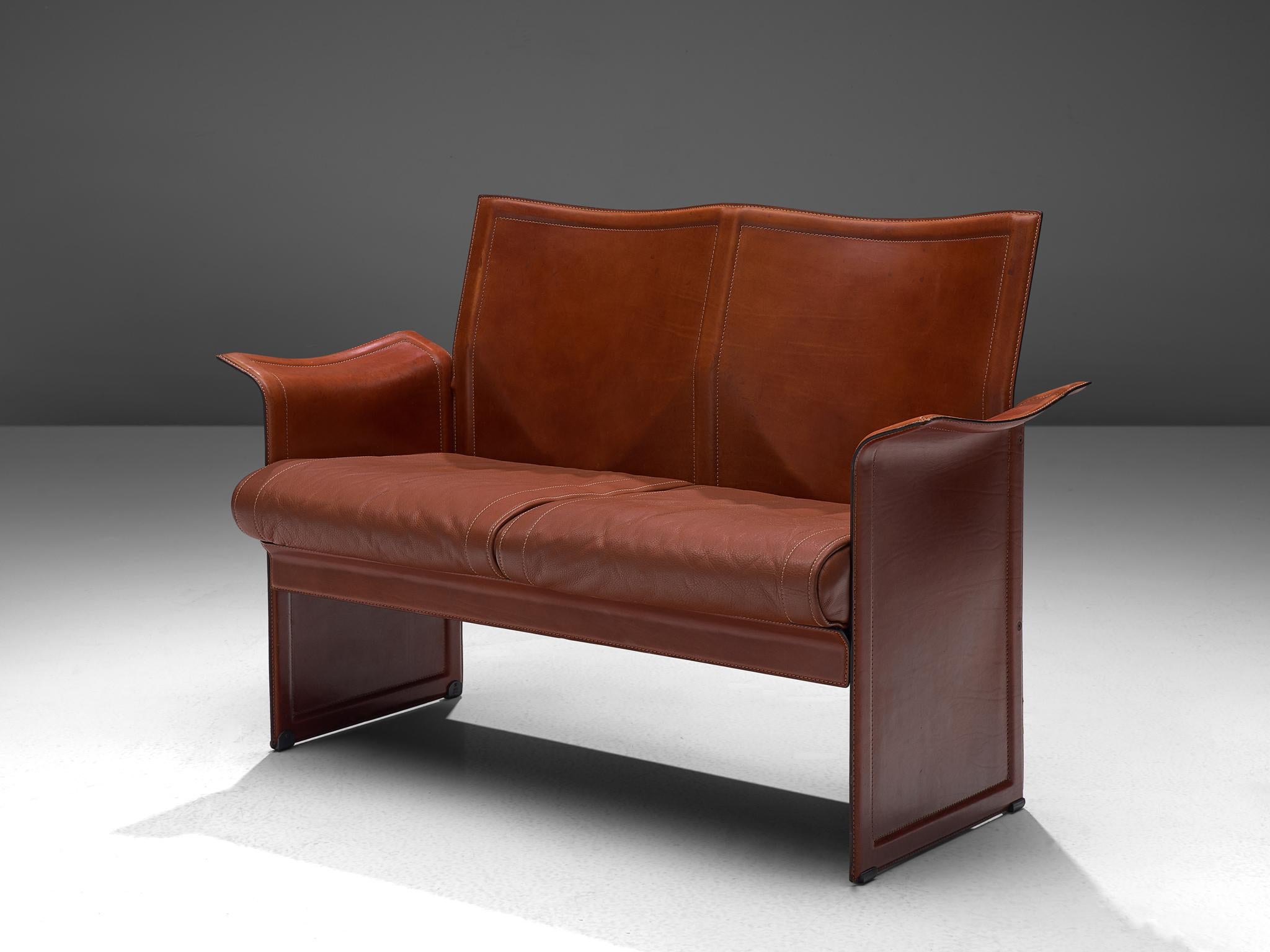 Tito Agnoli for Matteo Grassi, 'Korium' sofa, leather, steel Italy, 1970s

This sophisticated iconic 'Korium' cognac leather sofa was designed by Tito Agnoli for Matteo Grassi. It features a strong structure, with a wing like appearance and timeless