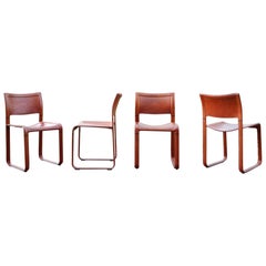 Tito Agnoli et Matteo Grassi ensemble de 4 chaises de salle à manger modèle Sistina en cuir oxydé
