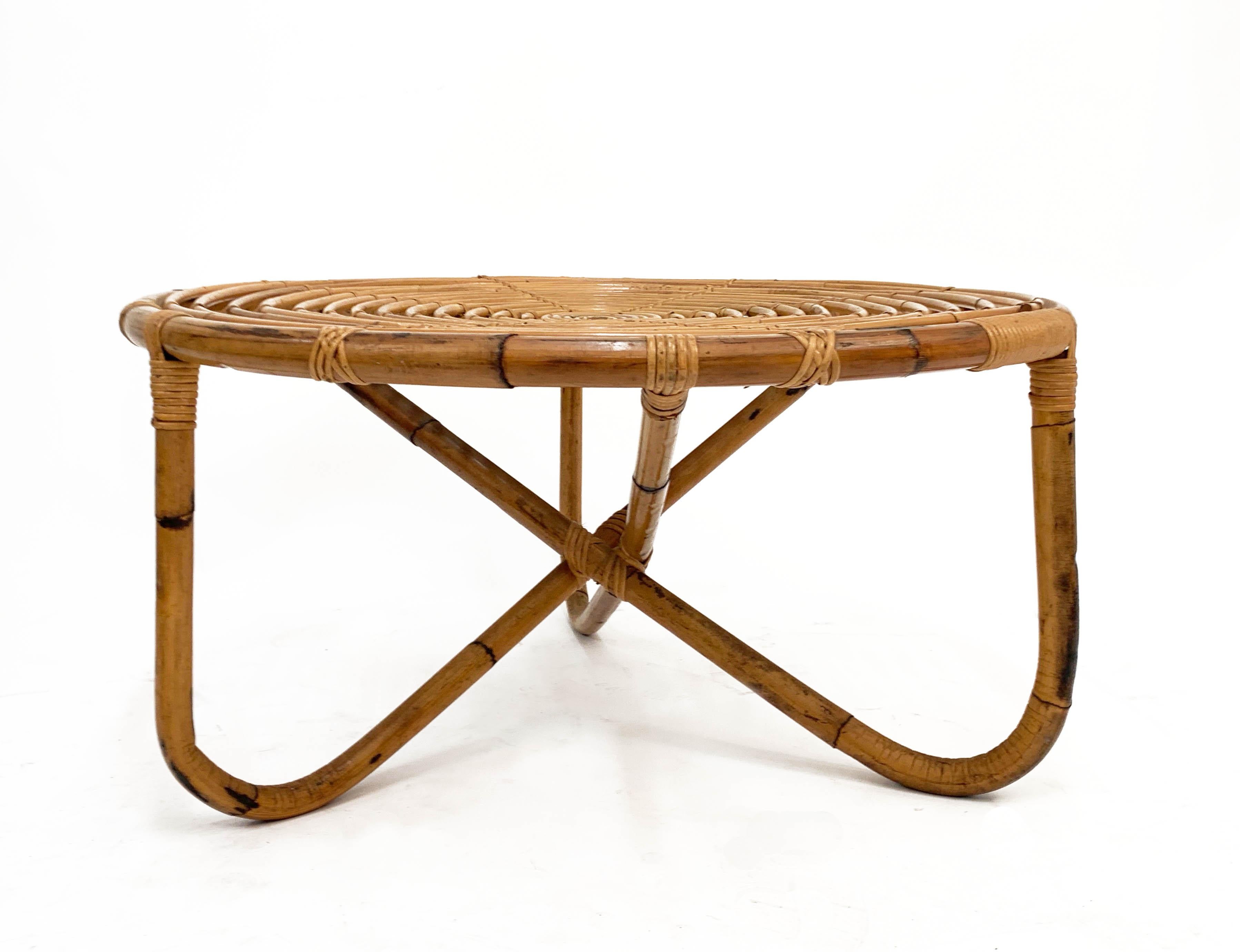 Amazing midcentury round rattan coffee table.

This wonderful piece, named 