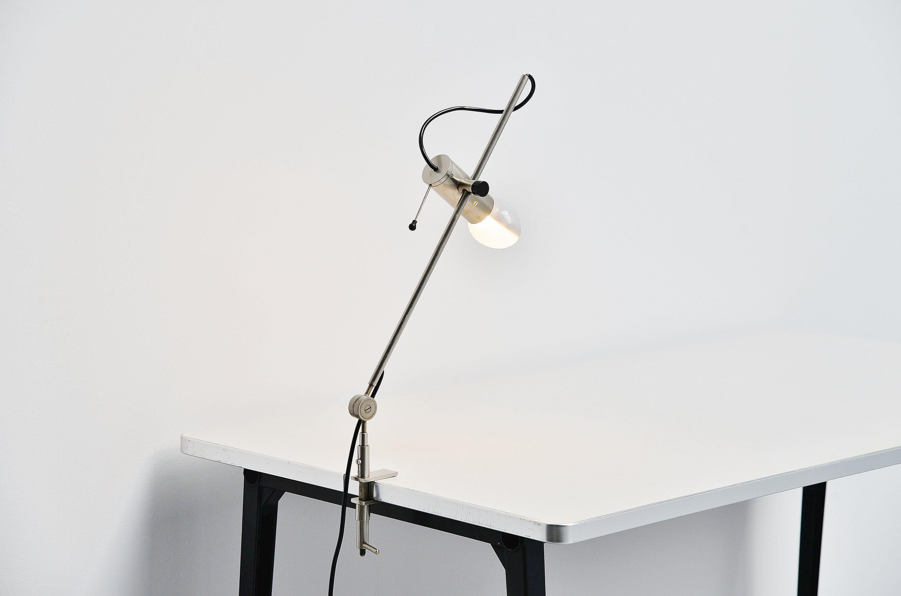 Very nice first production of the 255 desk clamp lamp designed by Tito Agnoli and manufactured by Oluce, Italy, 1954. This desk lamp is made nickel plated metal and is from the first production. This model is no longer in production and I find it