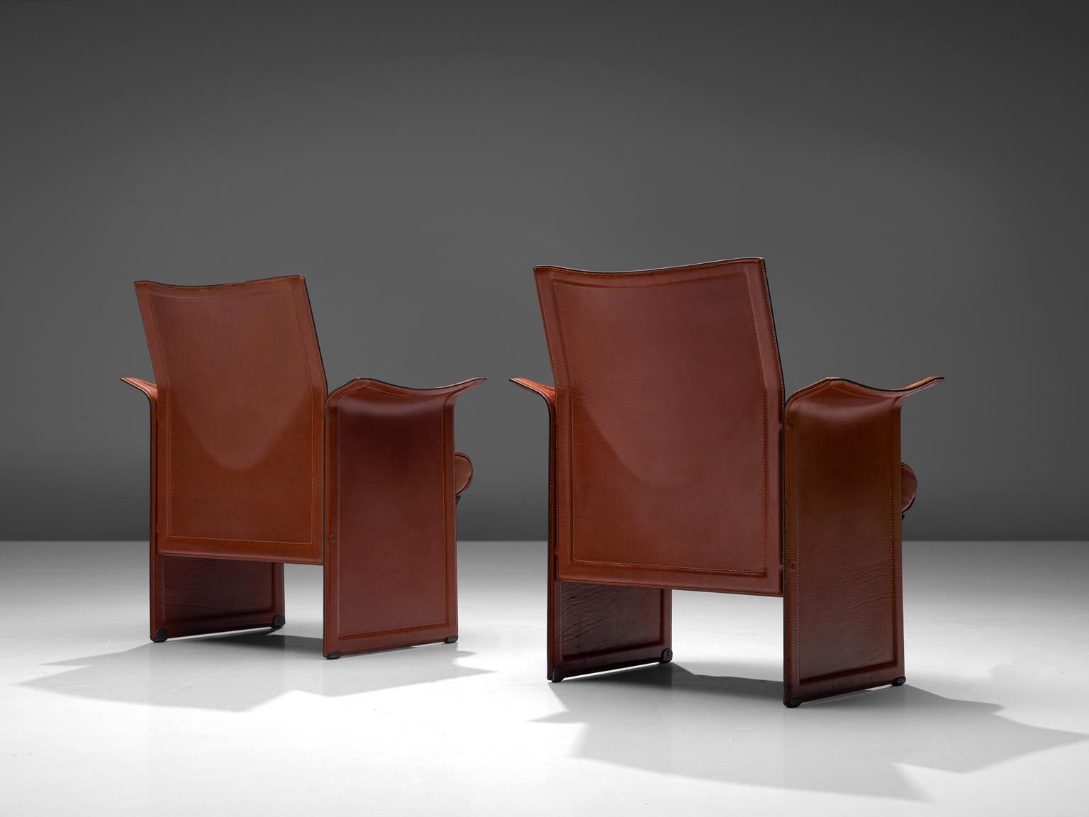 Tito Agnoli for Matteo Grassi, set of 2 Korium chairs, leather and metal, Italy, 1970s

These sophisticated iconic Korium cognac leather chairs were designed by Tito Agnoli for Matteo Grassi. It features a strong structure, with a wing like