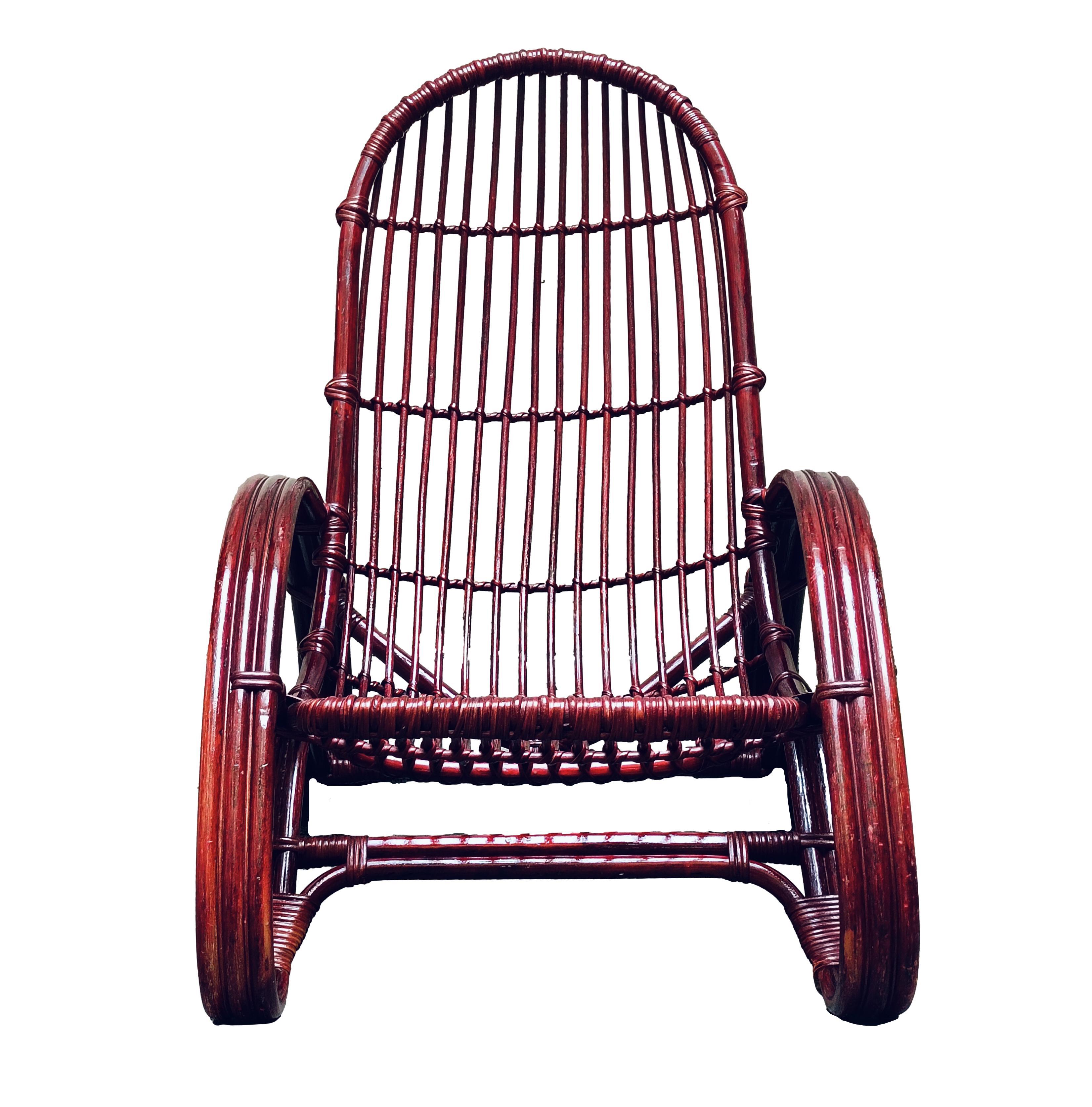 Elegant armchair from the 1960s, made in Italy by designer Tito Agnoli. The armchair is made of rush and prickly pear cane, coloured dark brown. Ideal for outdoors, they can also give an original touch inside the living area. The condition is