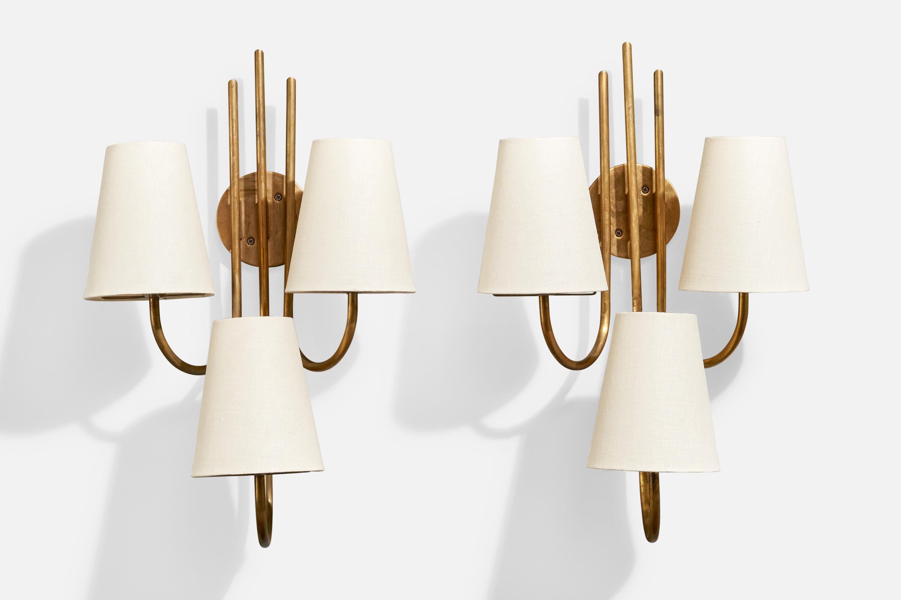 A pair of brass and fabric wall lights designed by Tito Agnoli and produced by O-Luce, Italy, 1960s.

Overall Dimensions (inches): 20.25” H x 13” W x 8.25“ D

Back Plate Dimensions (Inches):  4” H x 4” W x .75” D

Bulb Specifications: E-12

Number
