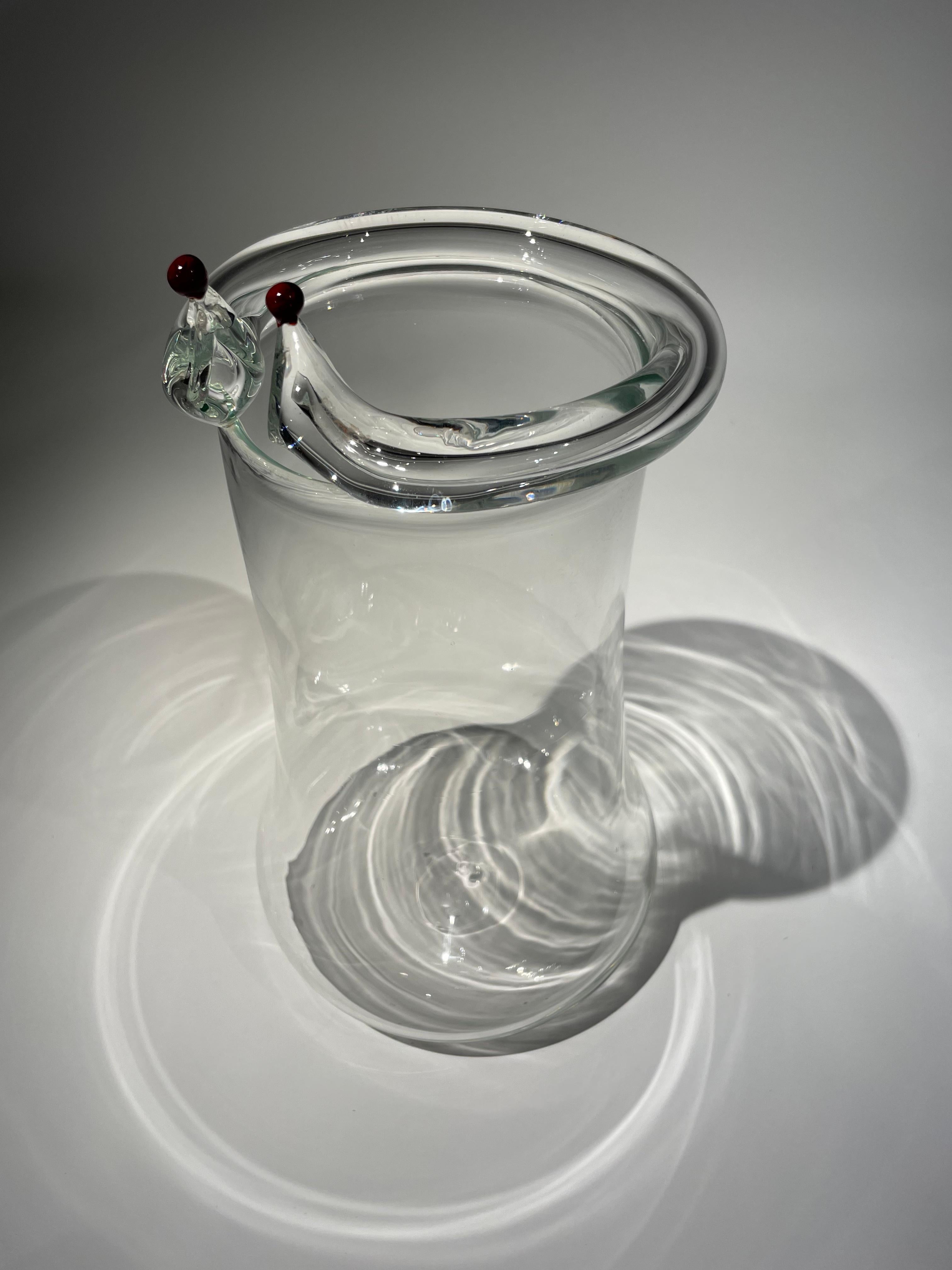 Introducing the stunning TITO glass design, crafted by the renowned designer Renato Toso from the new generation of designers in Murano. The '70s inspired linear and transparent design is both essential and eye-catching, making it a perfect addition