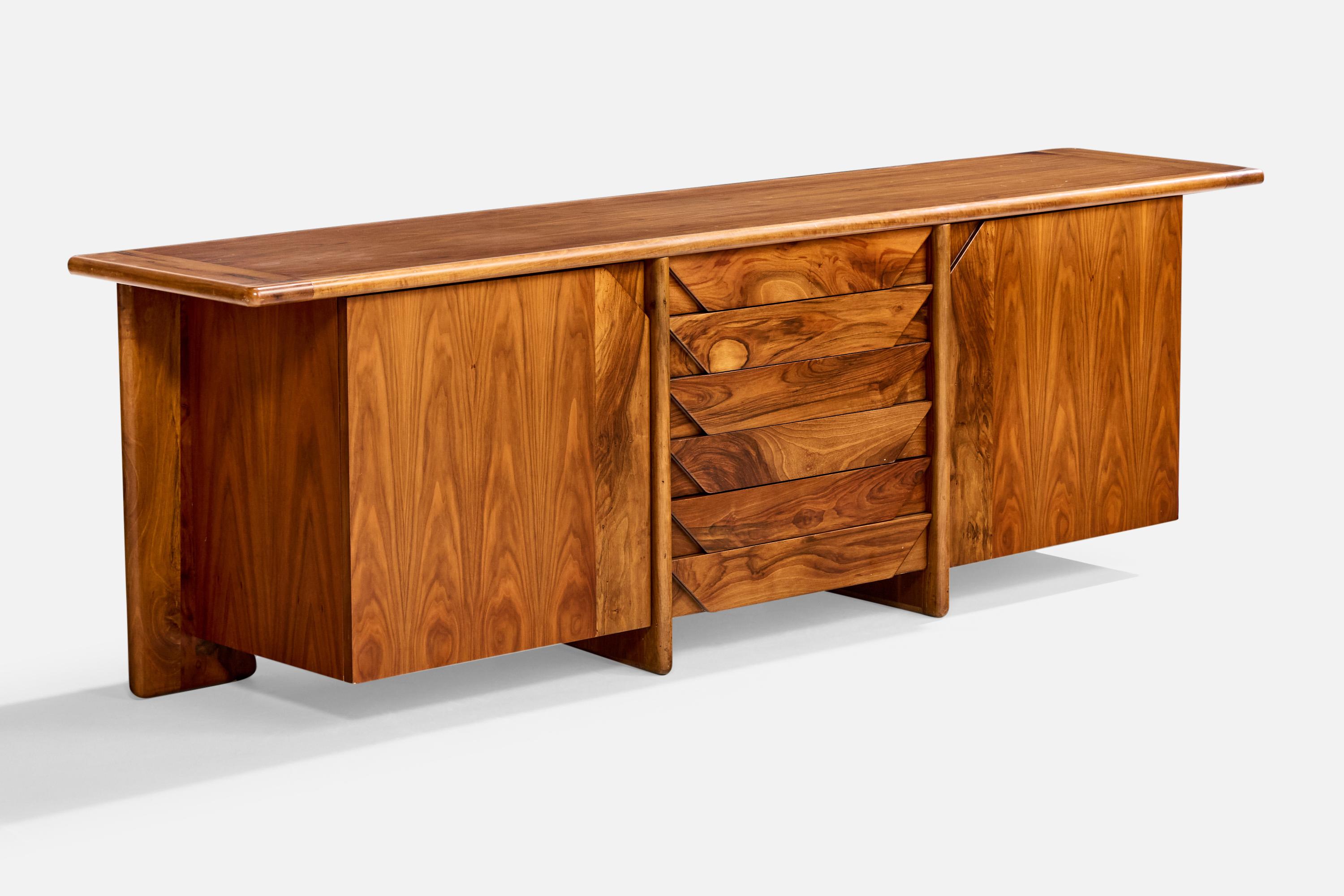 A walnut sideboard or cabinet designed by Tittina Ammannati and Vitelli Giampiero and produced by Catalano, Italy, c. 1970s.

Overall Dimensions (inches): 28.5