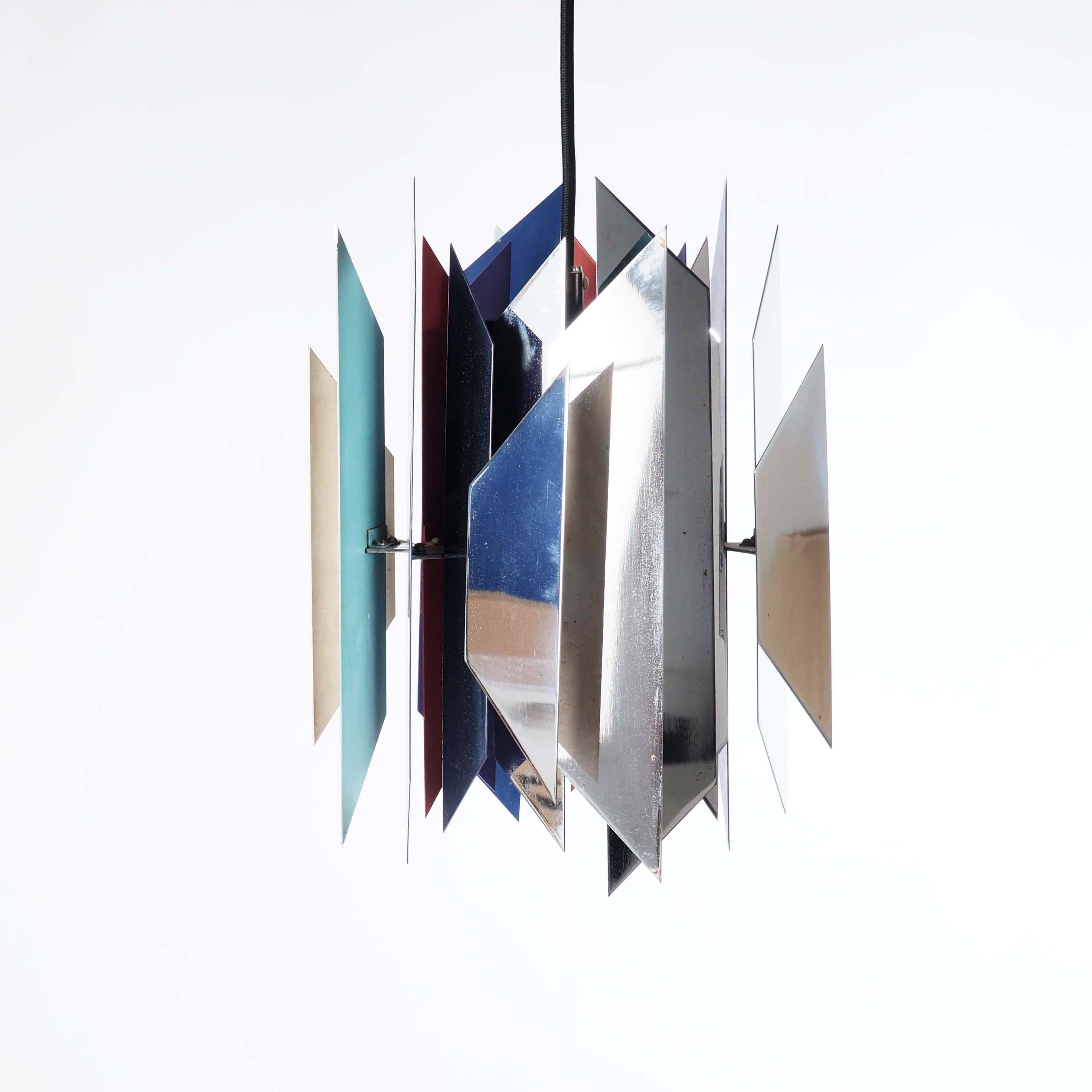 Hanging lamp by Simon Henningsen for Lyfa, Denmark. This lamp was designed for the restaurant Divan in the amusement park Tivoli in Copenhagen. Made of different lacquered and chromed metal slats is gives a joyful, warm and beautiful light. 

This