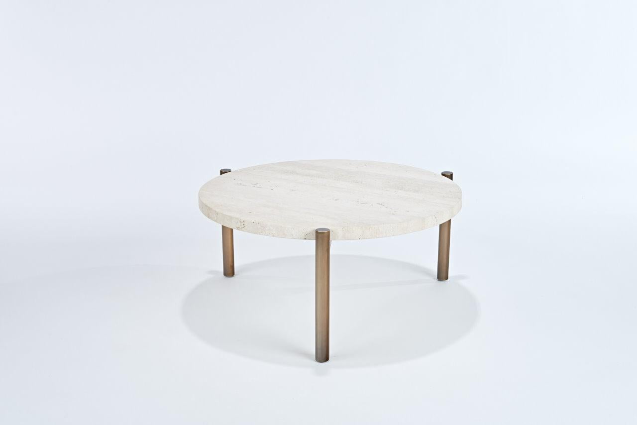 Ten10 Tivoli side table with 3 legs. The base is stainless steel tube plated in oil rubbed bronze. The top is 3cm thick vein cut unfilled honed travertine. The legs have adjustable glides. This table is suitable for indoor or outdoor use.