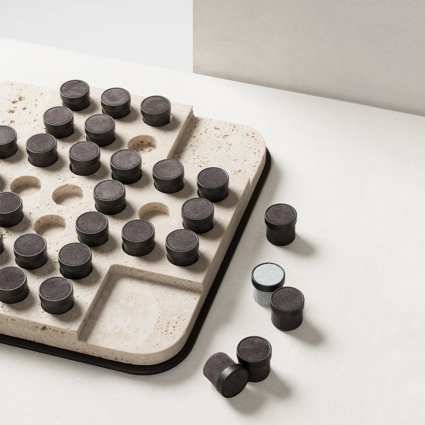 Marble playing field featuring a brushed bronze base. The set is equipped with pieces made of brushed bronze with leather inserts. Other marble finishes include arabescato white and travertino.