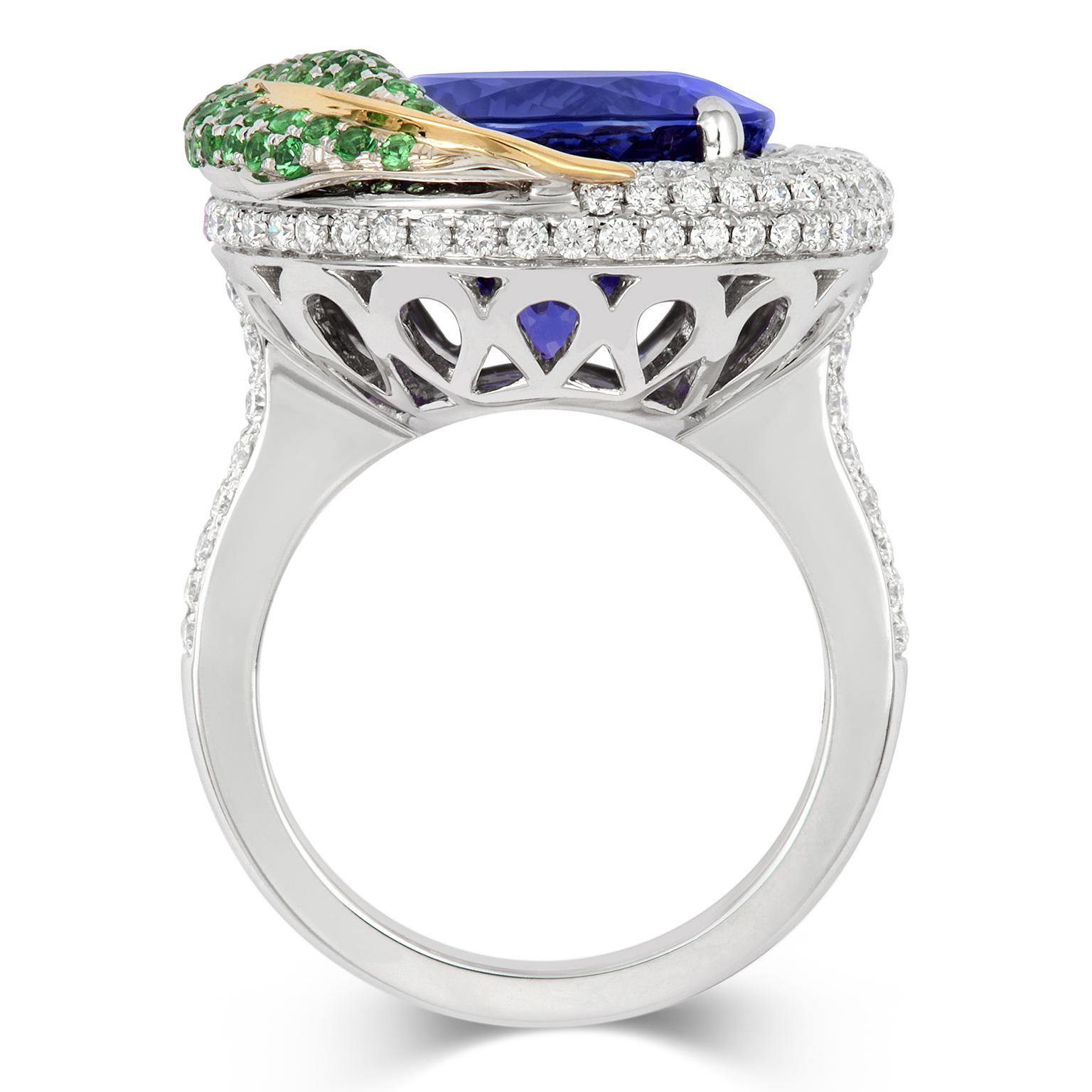 'THE RING OF PLENTY' - This stunning cocktail ring has been crafted in 18ct white & yellow gold and set with 1.22ct of glittering fine white diamonds, purple Sapphires, Tsavorite garnets and a vivid royal violet-blue AAAA 11.07ct Tanzanite. Inspired