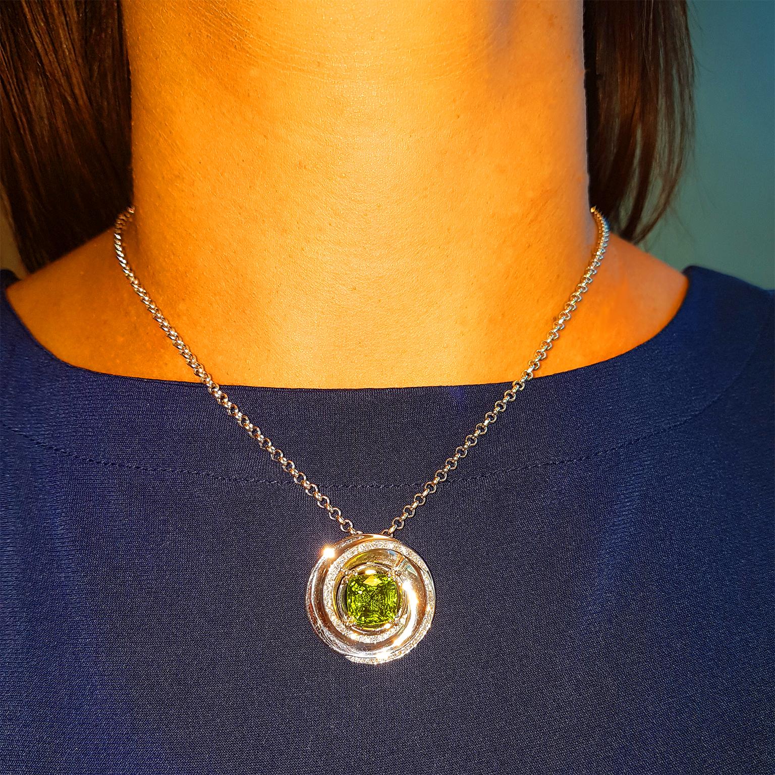 PERFECT PERIDOT! 

This magnificent designer pendant has been crafted in 18ct White Gold and set with a swirling blaze of fine diamonds (1.62ct G-VS) & a gorgeous opulent olivine 5.34ct Peridot gemstone. 

One-off & Exclusive! 
Standard 18ct 18 inch