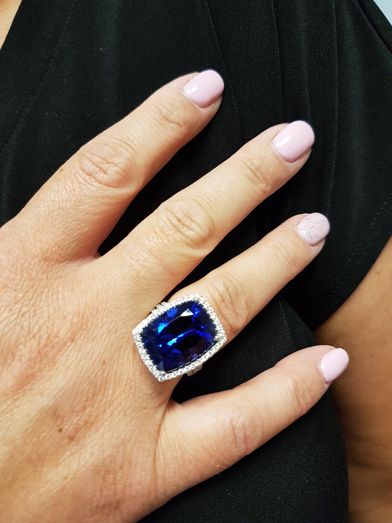 NOW THAT'S A RING! This 18ct white gold gala cocktail ring is set with one of the finest Tanzanite specimens we have. A vivid 17.36ct rich blue-VIOLET cushion-cut gem with flecks of red shimmering and dazzling the eye. And with the perfect