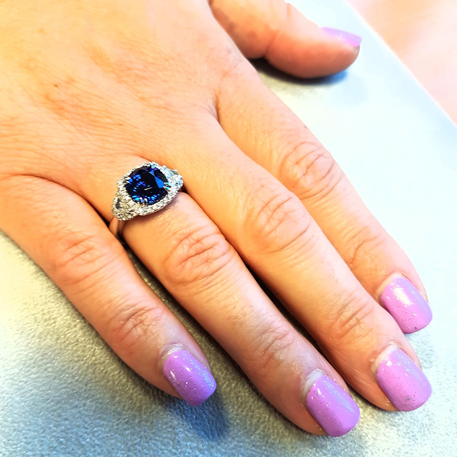 ROYAL BLUE! This gorgeous classic dress ring has been crafted in Platinum set with glittering fine white diamonds (0.70ct) & a certified cushion-cut 5.12ct 'ROYAL-BLUE' Ceylon Sapphire. One-off & Exclusive!