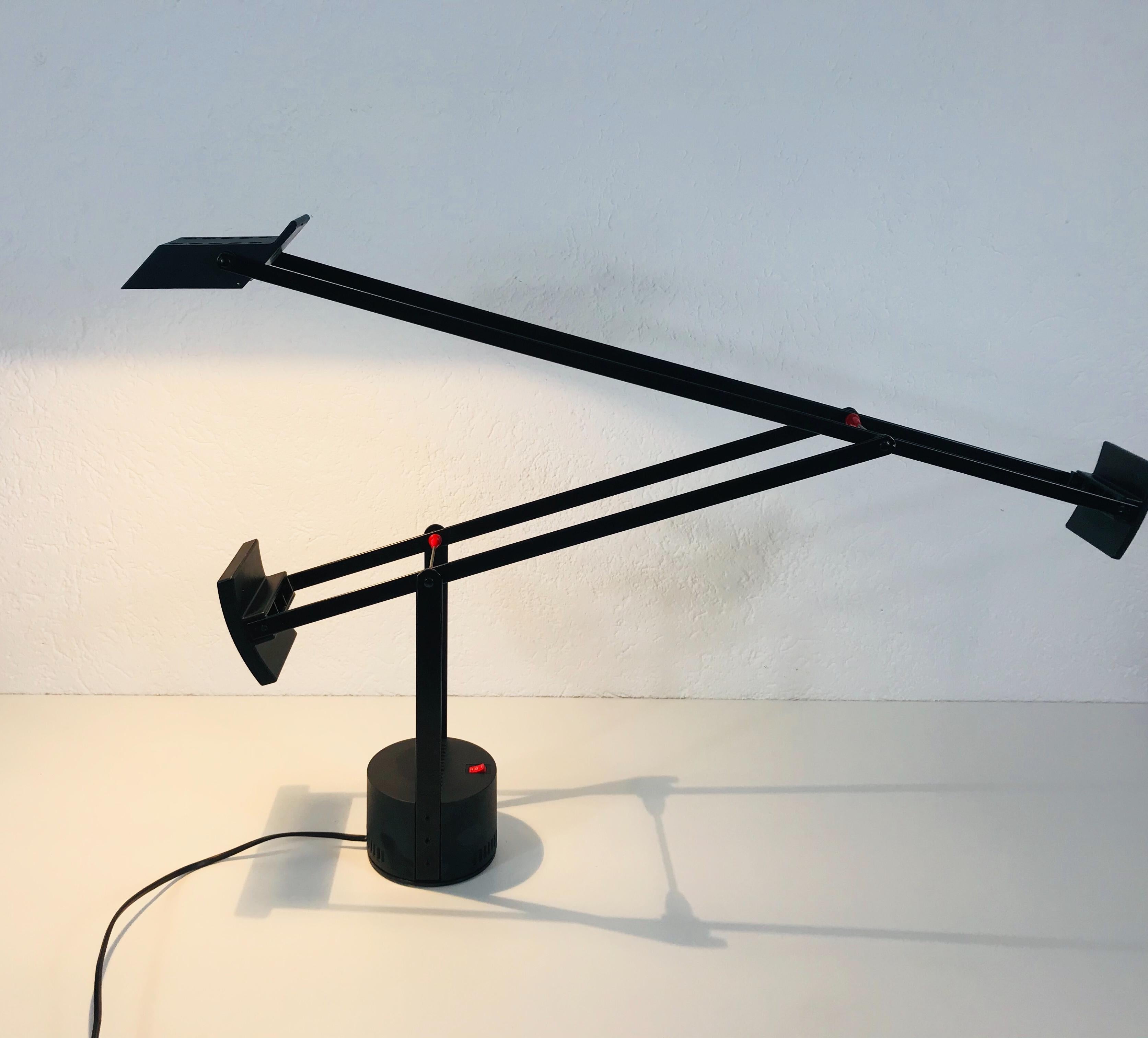 An adjustable table lamp from Richard Sapper for the top brand Artemide. The lamp was made and designed in Italy in 1972. It has a full black aluminum body.