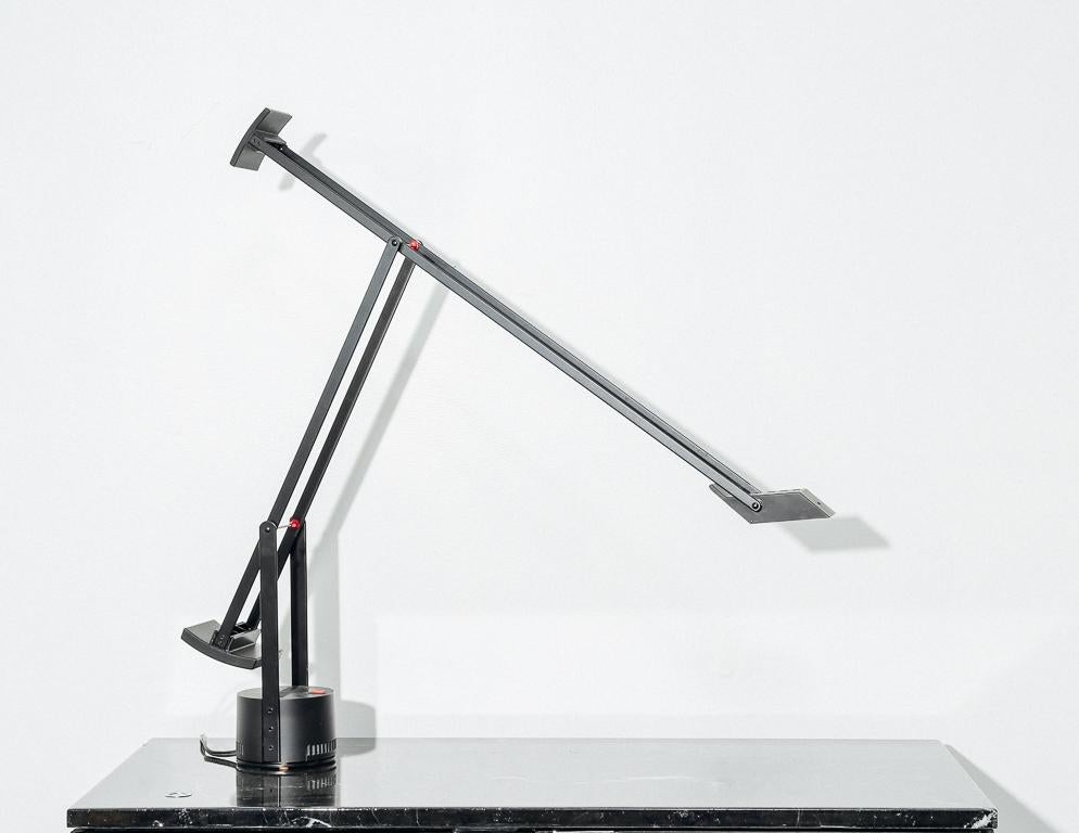 Halogen task lamp designed by Richard Sapper for Artemide, 1972. Two counterweights keep the lamp in position while the bulb is illuminated via conductivity of the arms.