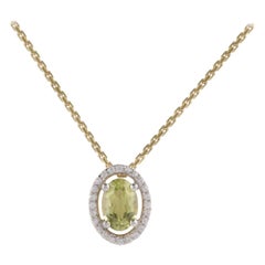 TJD 0.07 Carat Diamond and 6X4MM Oval Peridot 18 Karat Yellow Gold Halo Pendant
