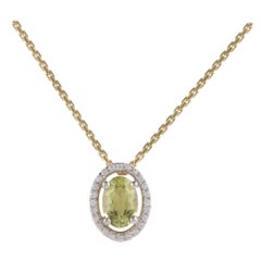 TJD 0.07 Carat Diamond and 6X4MM Oval Peridot 18 Karat Yellow Gold Halo Pendant