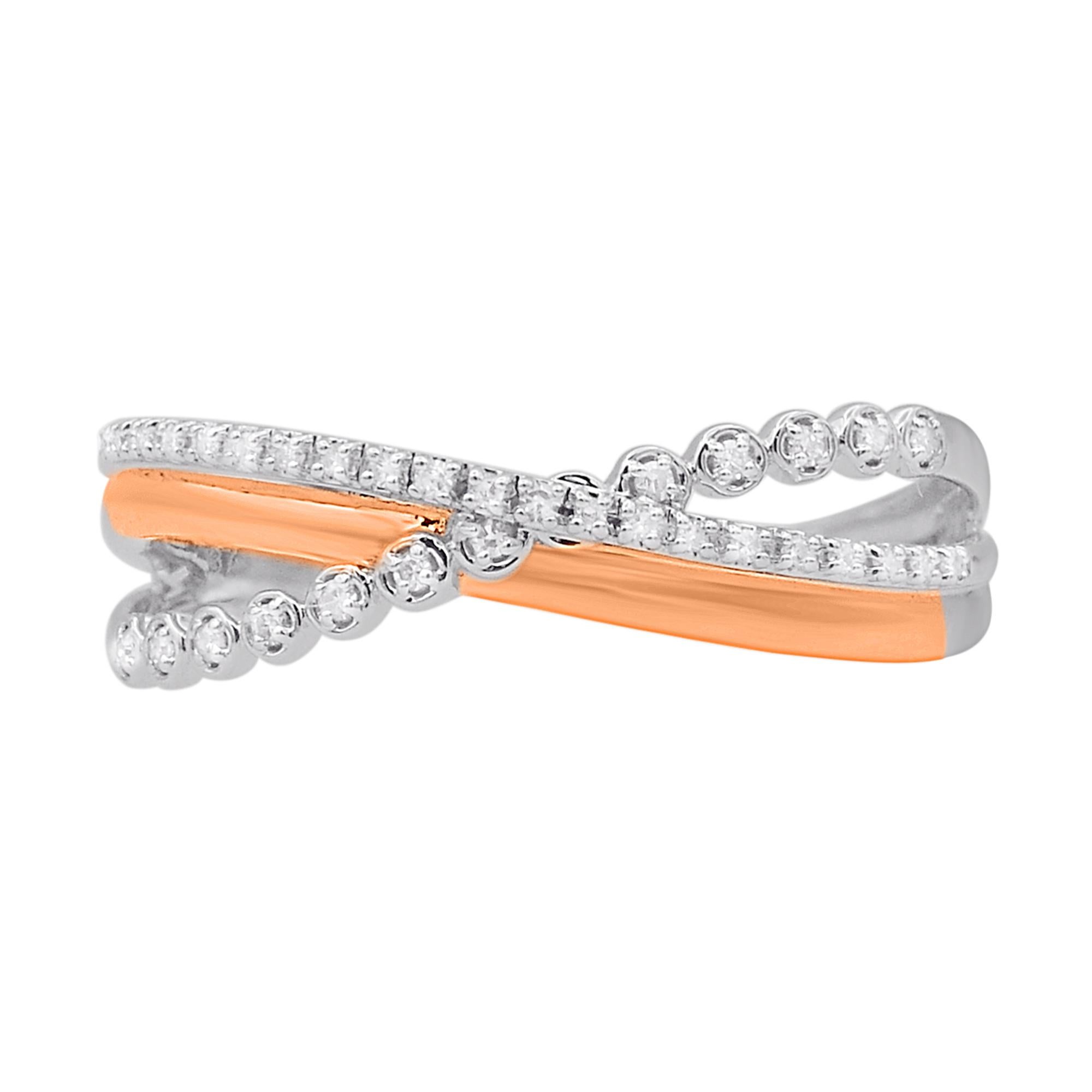 Create a sensation with the sparkling design of this diamond triple row crossover ring. Beautifully crafted by our inhouse experts in 14 karat two-tone gold and embellished with 33 round diamond set in prong setting. Total diamond weight is 0.07