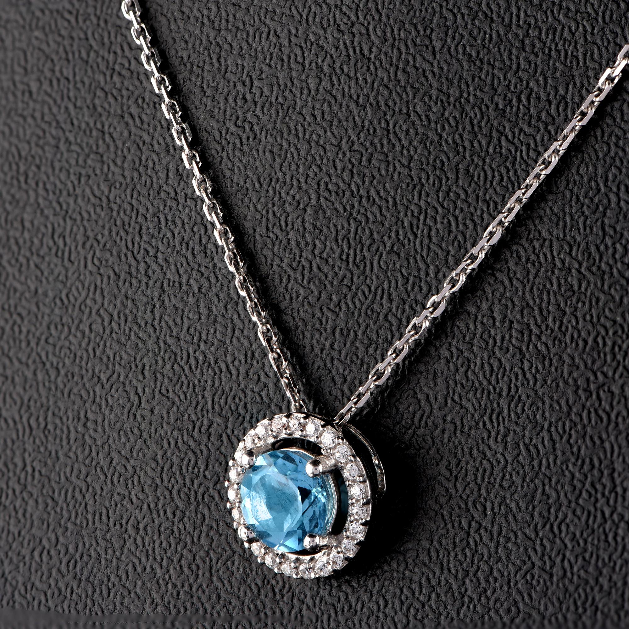 Modern TJD 0.07 CTW Diamond and 5MM Round Swiss Blue Topaz 18K White Gold Halo Pendant For Sale
