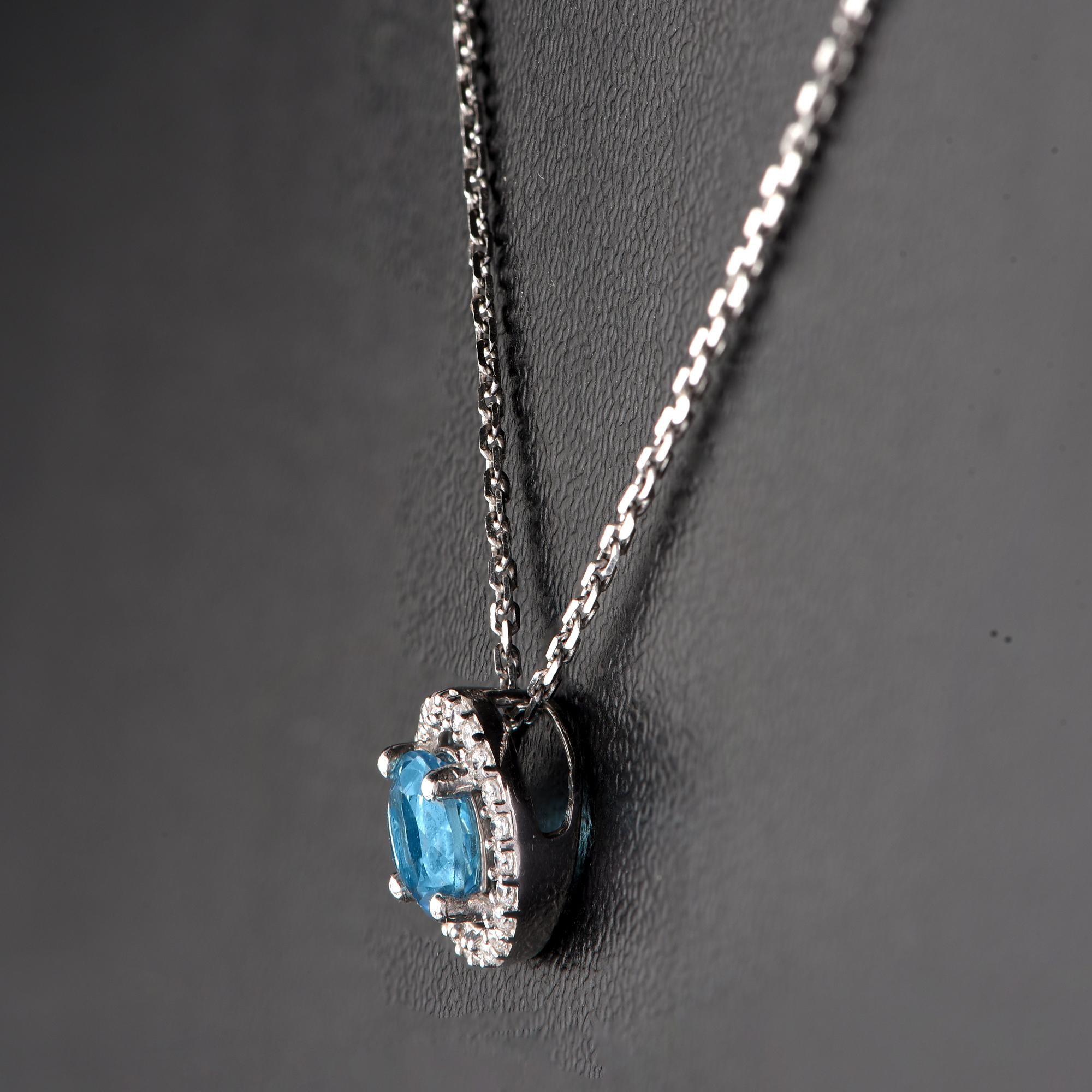 Round Cut TJD 0.07 CTW Diamond and 5MM Round Swiss Blue Topaz 18K White Gold Halo Pendant For Sale