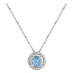 TJD 0.07 CTW Diamond and 5MM Round Swiss Blue Topaz 18K White Gold Halo Pendant