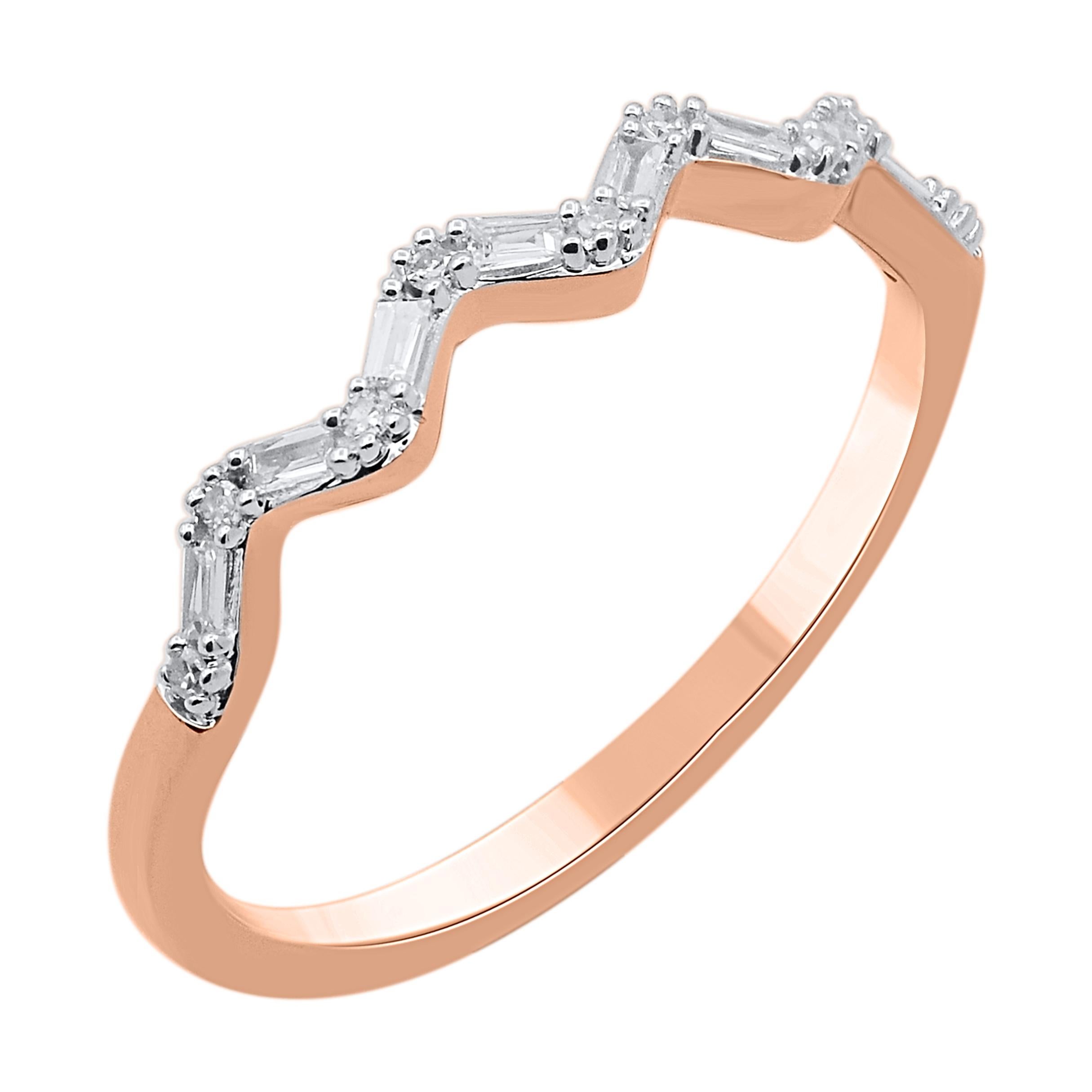 Celebrate all the wonderful little things with this slim diamond anniversary band. This ring is beautifully crafted in 14 Karat rose gold and embedded with 17 single cut round diamonds & baguette diamond set in prong setting. Total diamond weight is