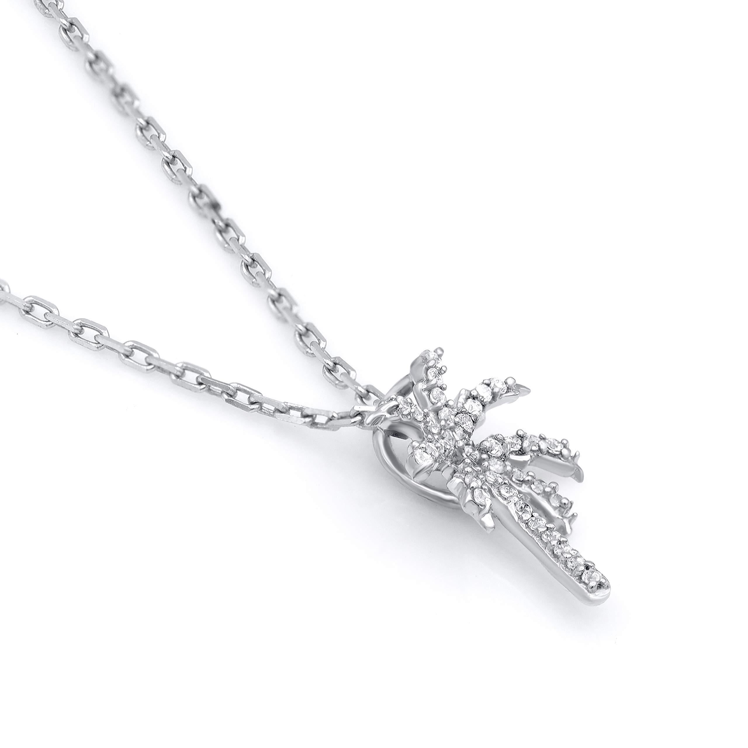 You can almost feel the tropical breeze when you wear this diamond palm tree pendant. This pendant is crafted from 14-karat white gold and features 38 single cut diamonds set in prong setting. H-I color I2 clarity and a high polish finish complete