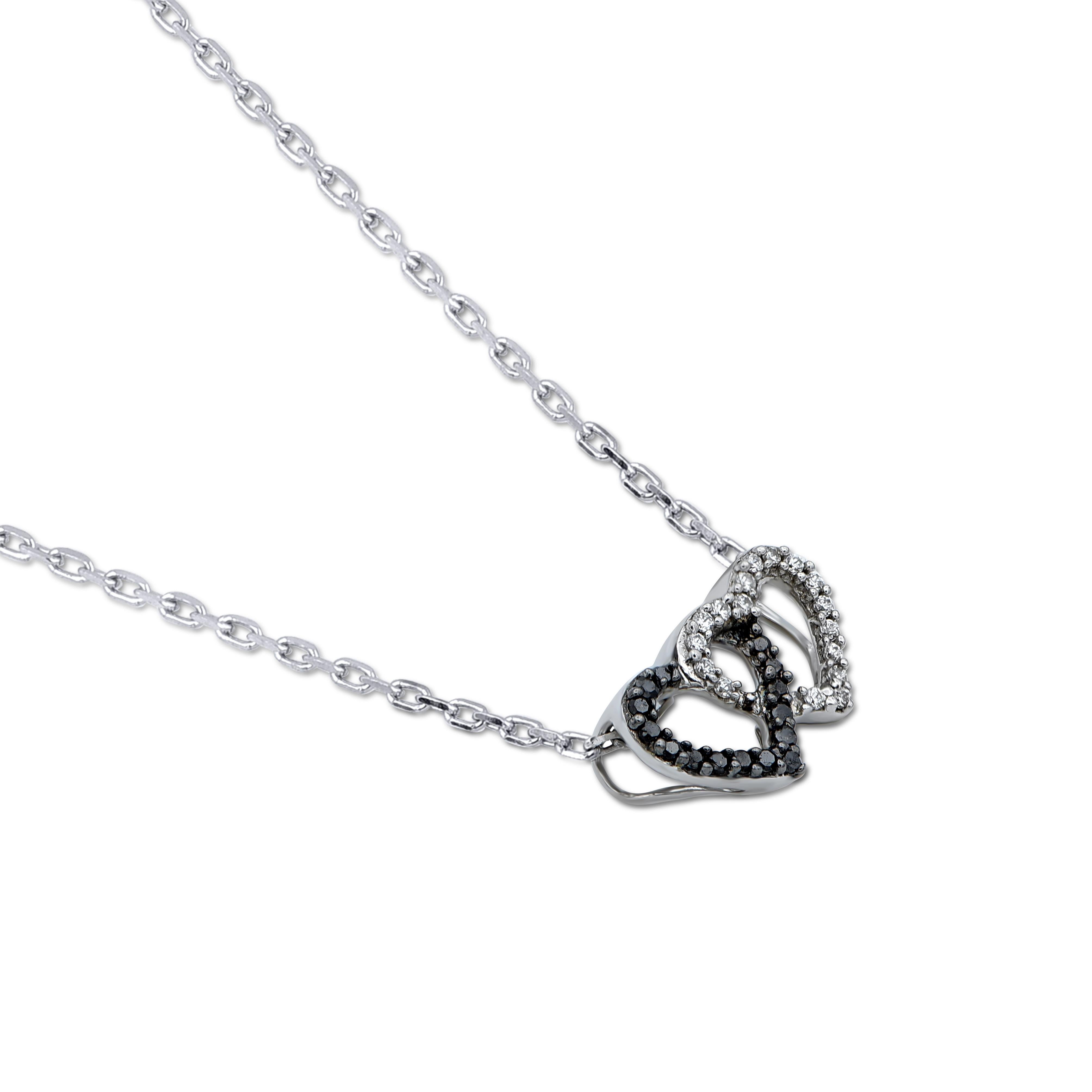 A striking addition when worn on its own, this diamond pendant makes a stunning impression. This heart pendant is crafted from 14-karat white gold and features 32 single cut & black treated diamonds set in prong setting. H-I color I-2 clarity and a