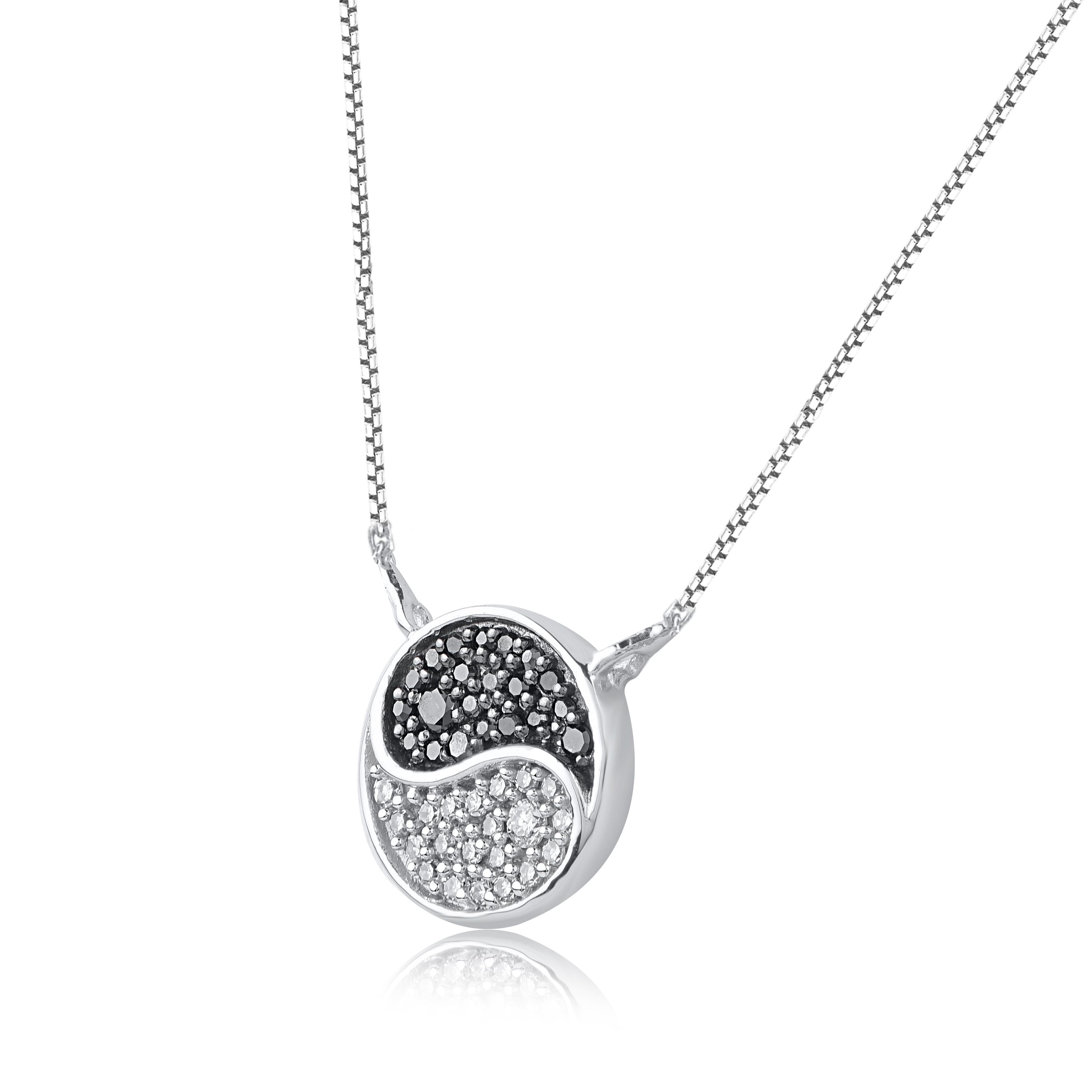 This diamond yin-yang pendant fits any occasion with ease. These pendant is studded with 42 single cut, brilliant cut & black treated diamonds in pave setting and crafted in 14 karat white gold. Diamonds are graded as H-I color and I-2 clarity.