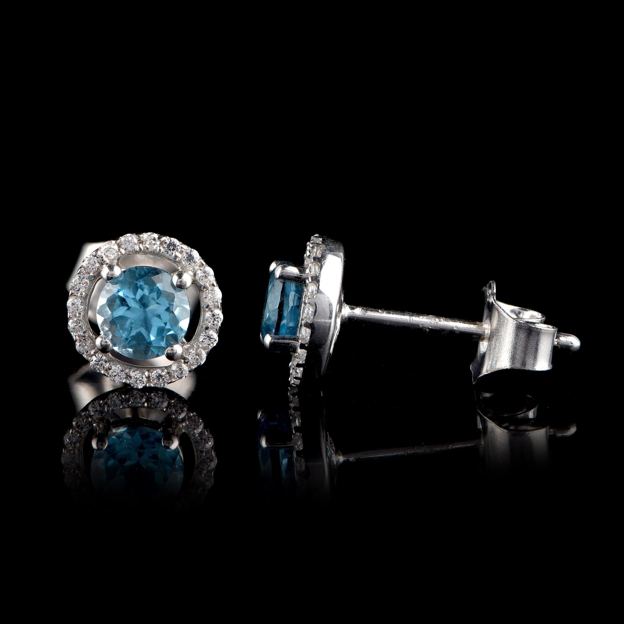 Round Cut TJD 0.10 CTW Diamond and 4MM Round Swiss Blue Topaz 18K White Gold Halo Earrings For Sale