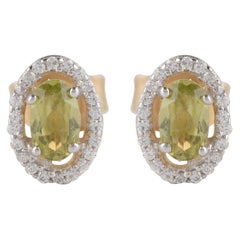 TJD 0.10 CT Diamond and 5X3MM Oval Peridot 18 Karat Yellow Gold Halo Earrings