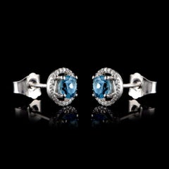 TJD 0.10 CTW Diamond and 4MM Round Swiss Blue Topaz 18K White Gold Halo Earrings