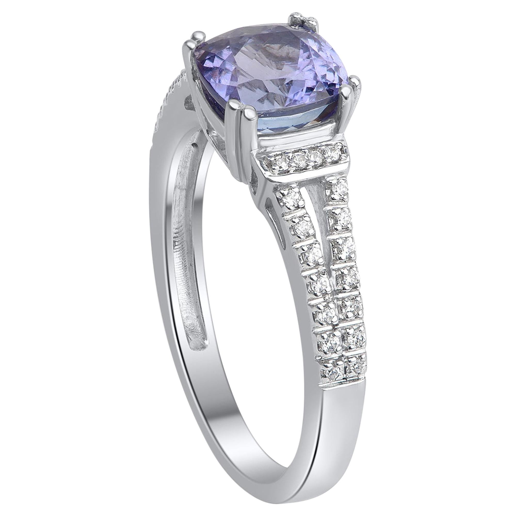 Studded with 36 natural brilliant diamonds and 1 natural tanzanite beautifully in pave & prong setting and handcrafted by our experts in 14-karat white gold. This tanzanite and diamond ring adds a bright pop of color. Diamonds are graded HI color,