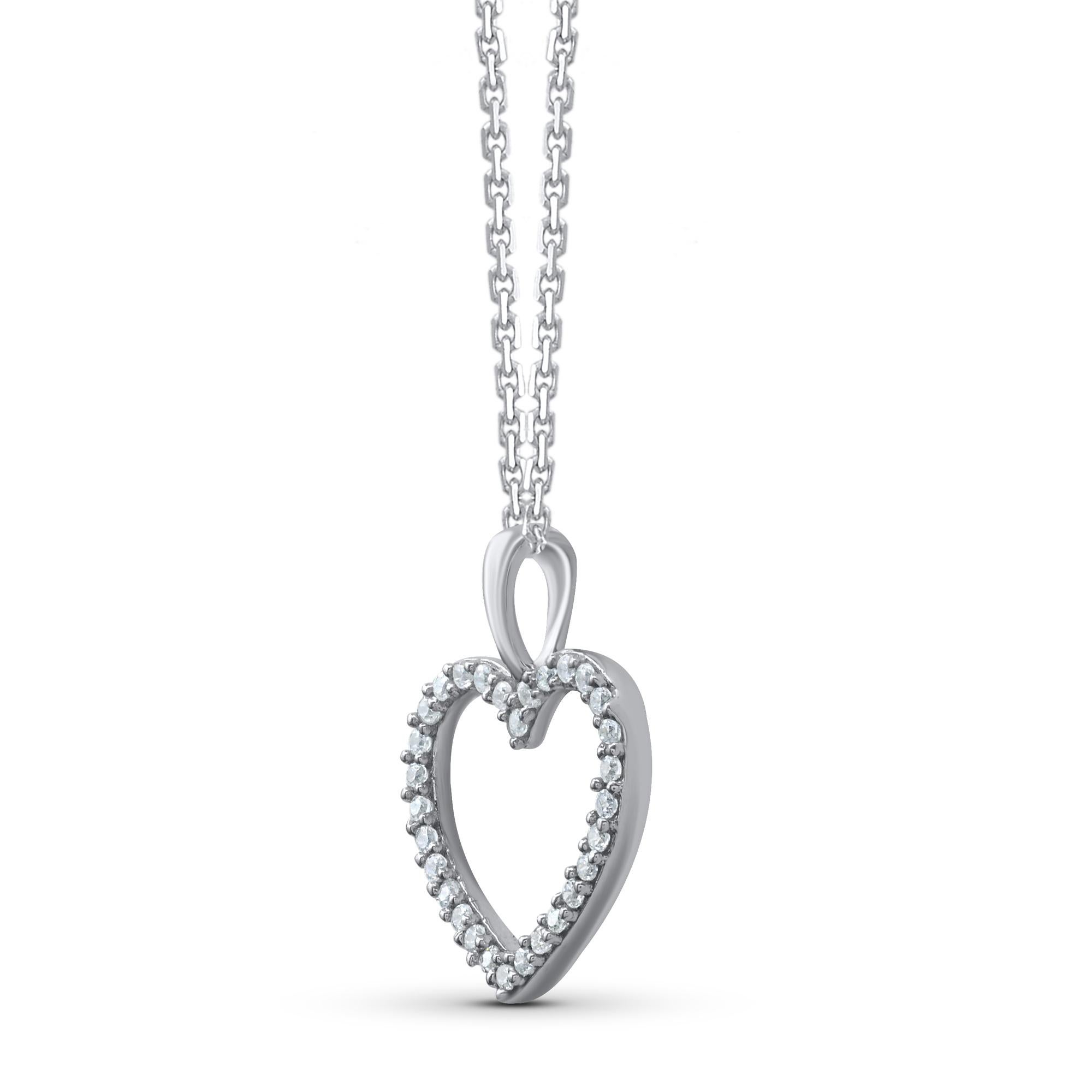 Bring charm to your look with this diamond heart pendant necklace. The pendant is crafted from 14 karat white gold and features 30 round single cut diamond set in pave setting and a high polish finish complete the brilliant sophistication of this
