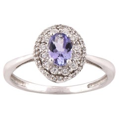 TJD 0.13 CT Diamond and 6X4mm Oval shape Swiss Blue Topaz 14 KT White Gold Ring