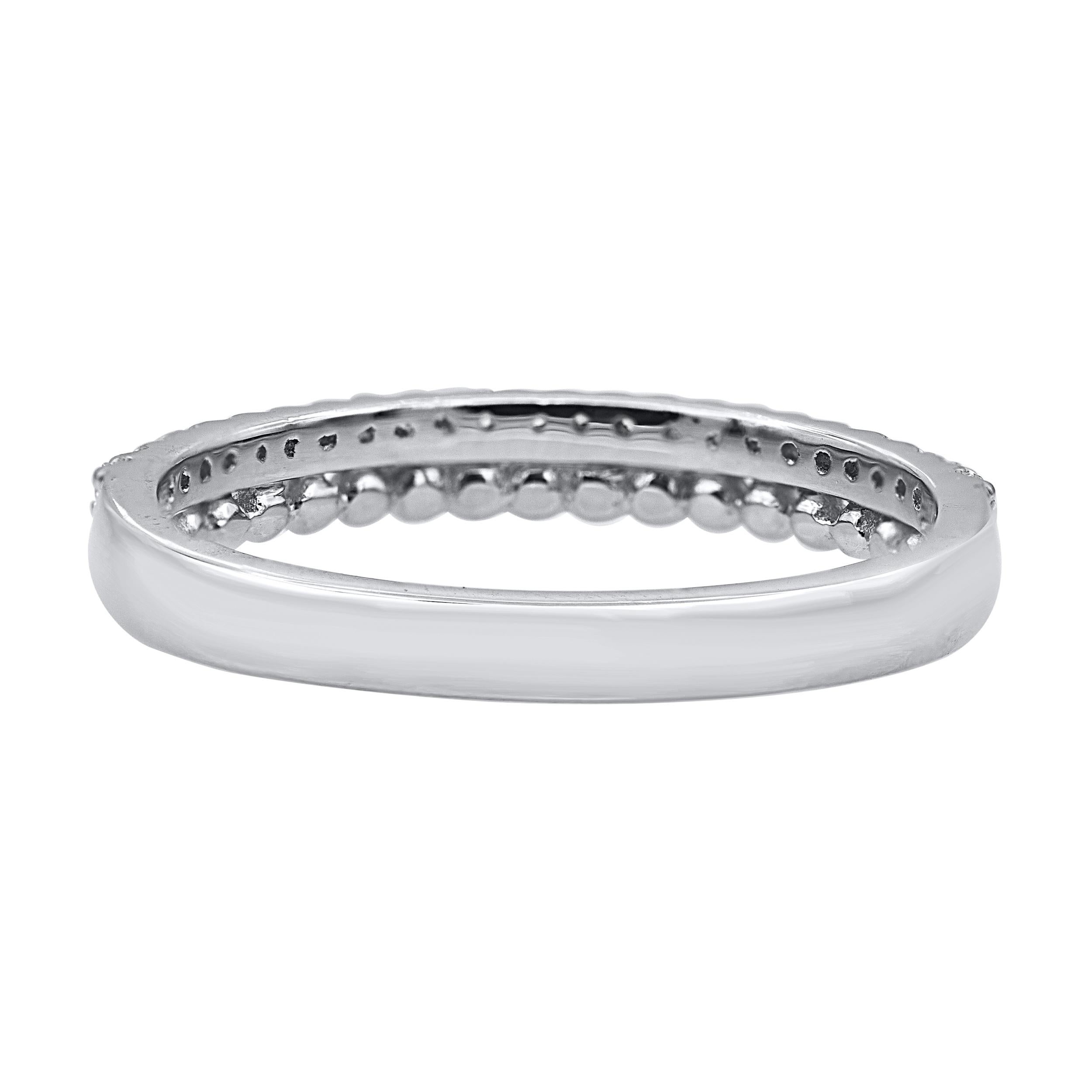 A bright and beautiful choice for any occasion, this sparkling diamond anniversary band gives her a moment to remember. The ring is crafted from 14-karat white gold and features round brilliant cut 23 diamonds in prong setting. The diamonds are
