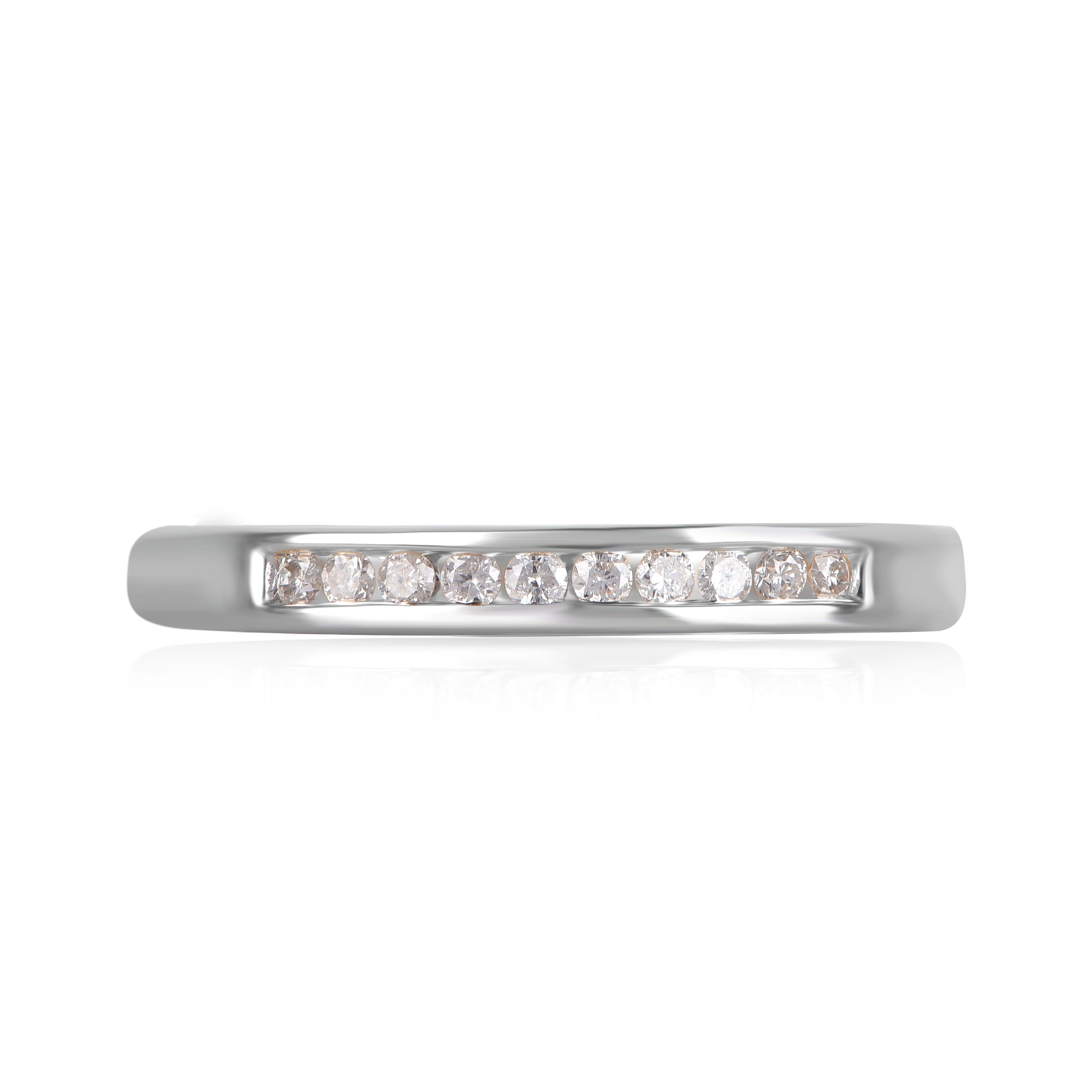 Bring charm to your look with this diamond wedding band Ring. This ring is beautifully crafted in 14 Karat white gold and embedded with 10 natural brilliant cut diamonds in channel setting. Total diamond weight is 0.15 carat. The diamonds are graded