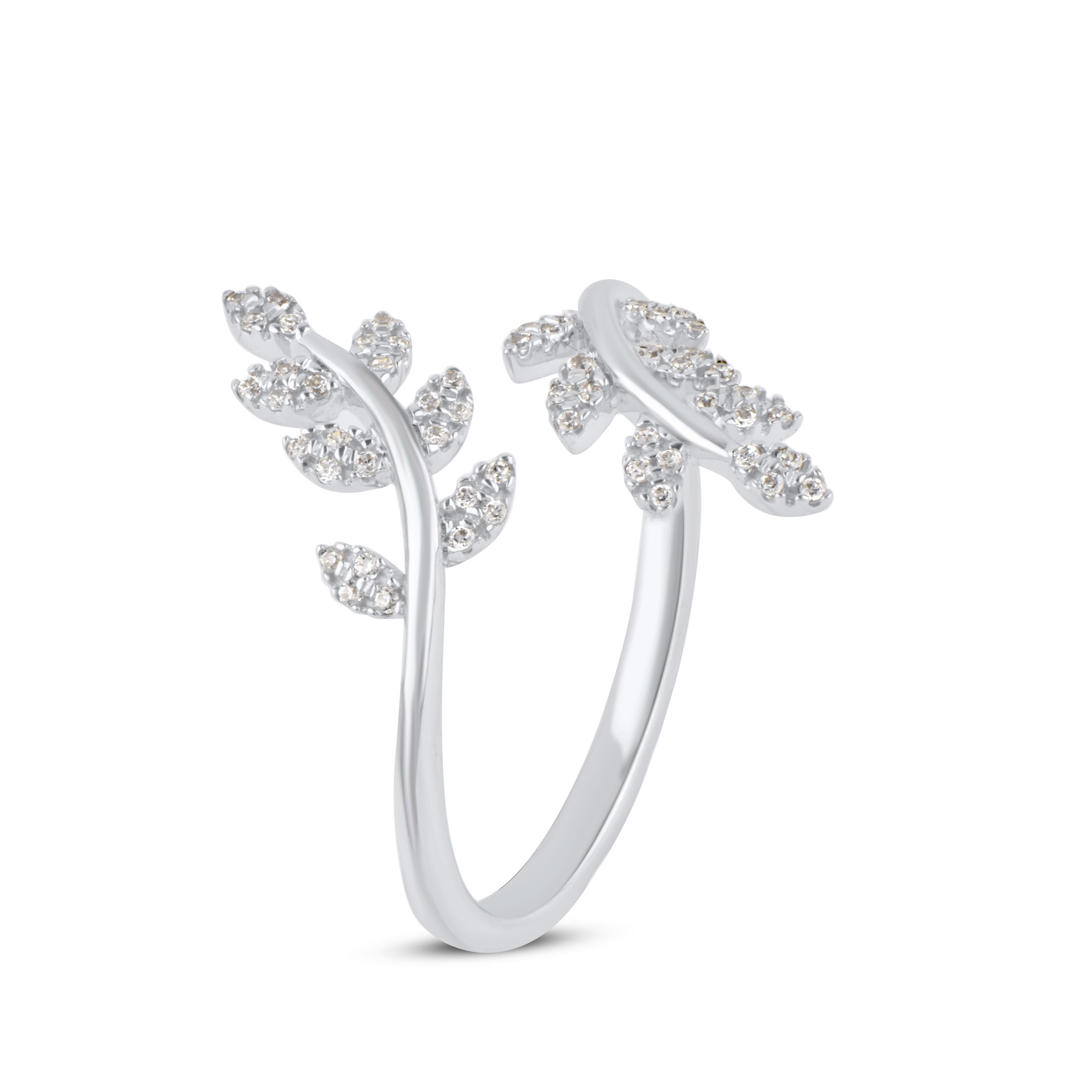 Bring charm to your look with this diamond Bypass Ring. This ring is beautifully crafted in 14 Karat white gold and embedded with 56 single cut round diamonds in prong setting. Total diamond weight is 0.15 carat. The diamonds are graded as H-I color