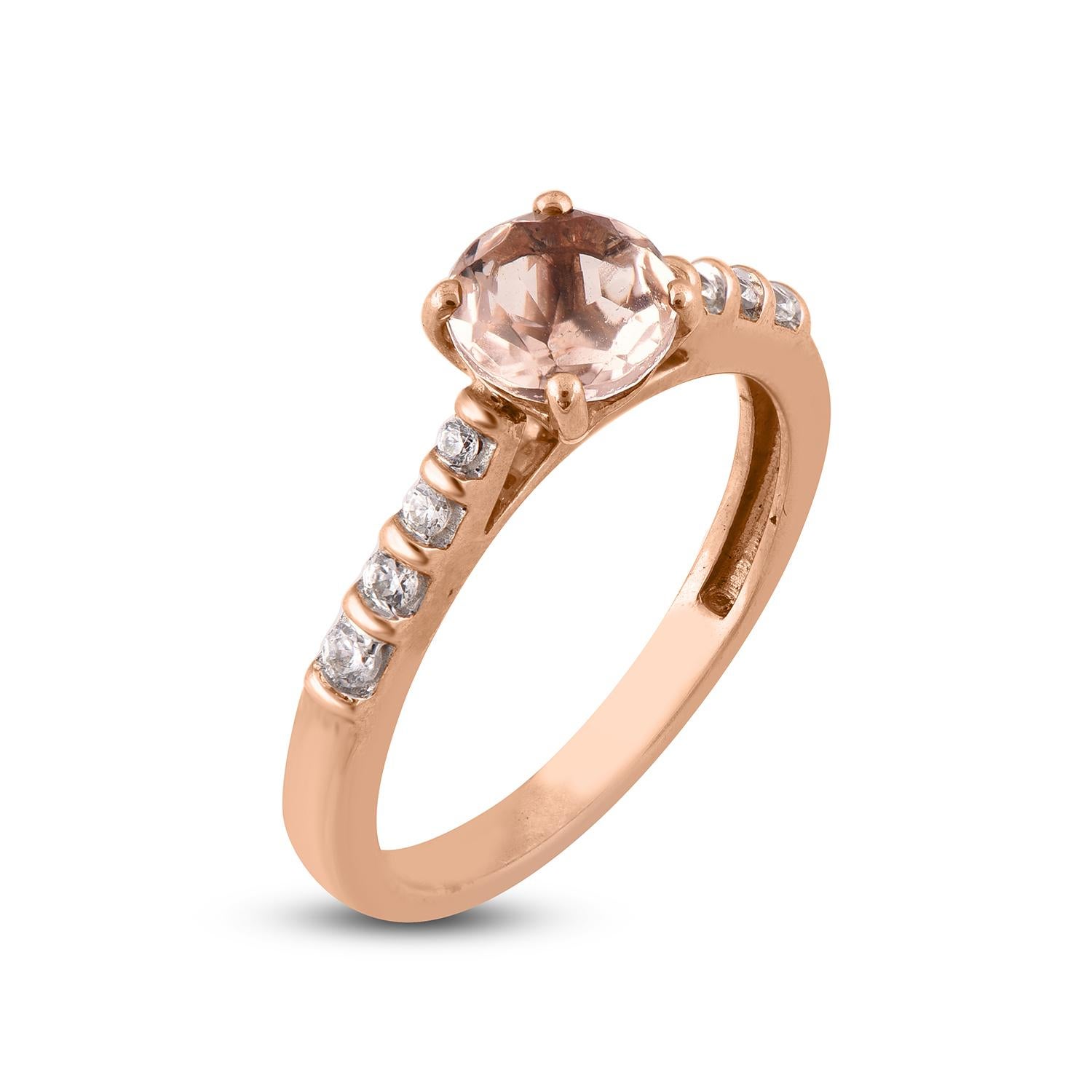 These morganite and diamond studded ring is perfect for your special day. Expertly handcrafted in 14 karat Rose gold and studded with 8 white round diamond and 1 natural morganite stone set in prong and channel setting. Diamonds are graded H-I