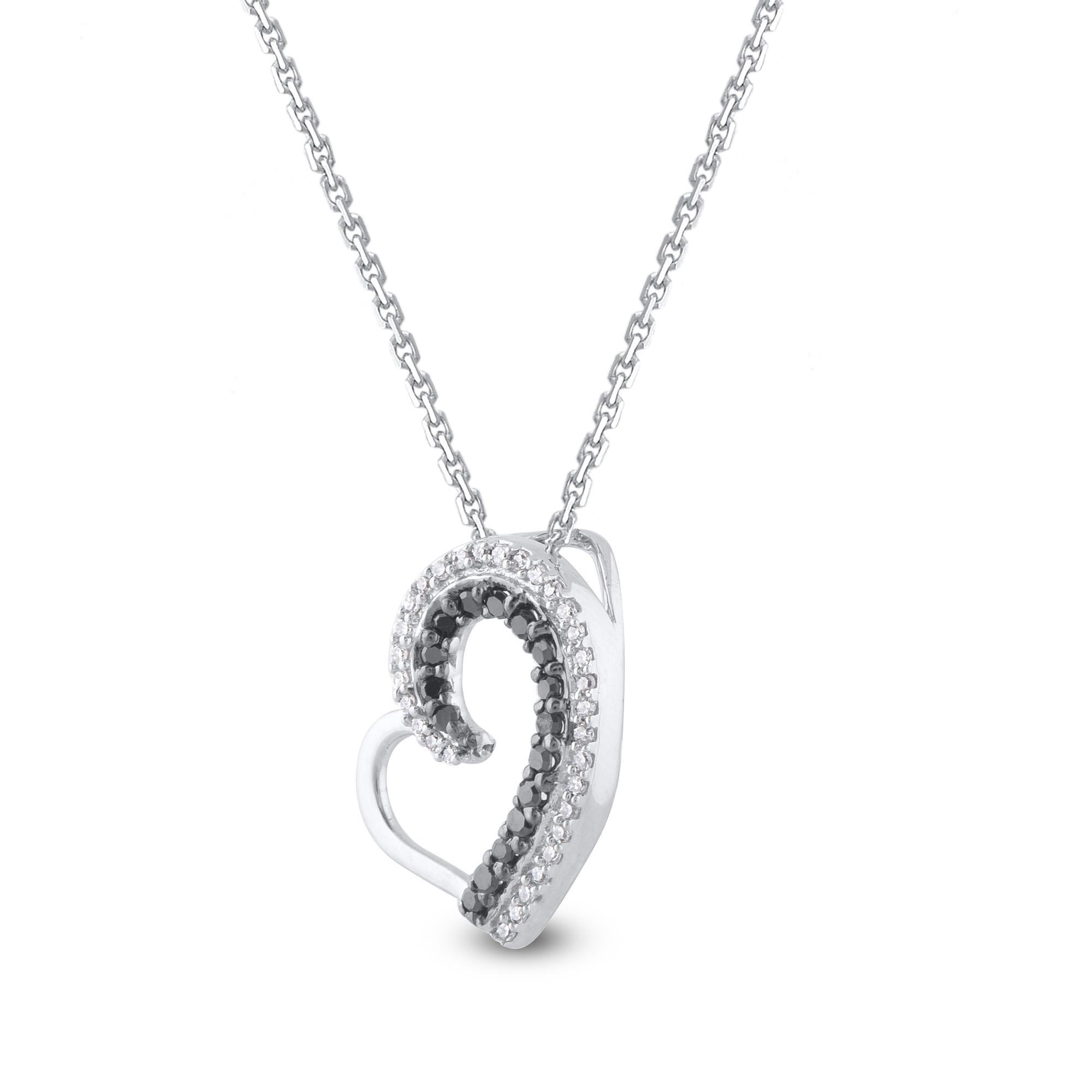 Surprise the one you love with this mesmerizing diamond heart pendant. This heart pendant is crafted from 14-karat white gold and features 47 single cut white diamonds & treated black diamonds set in prong setting. H-I color I2 clarity and a high