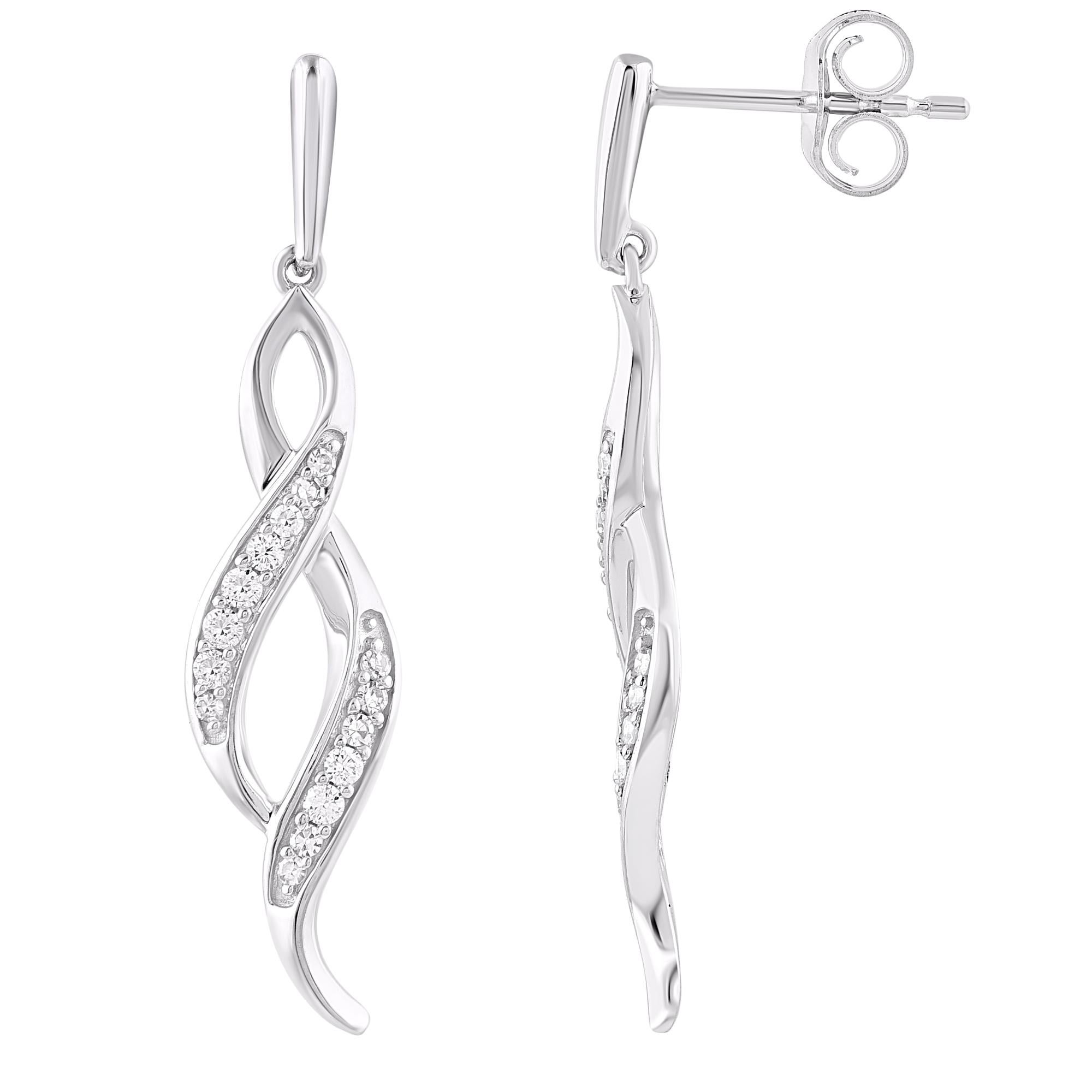 With one look of this 0.18 Carat Beautiful Round diamond swirl earring crafted in 14kt white gold. This earring is beautifully designed and studded with 30 round diamond set in prong setting. We only use natural diamond which shines in H-I Color and