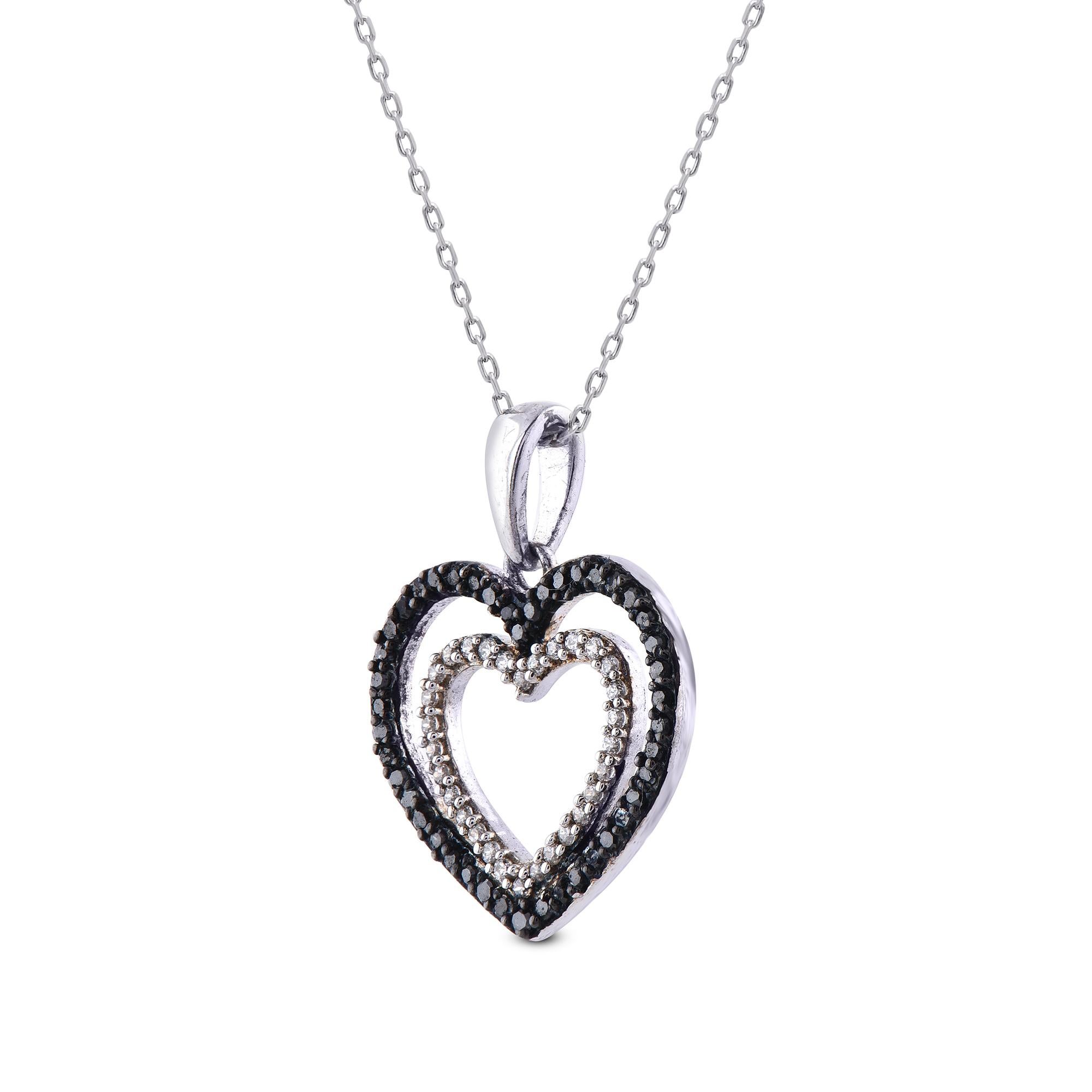 This Double heart pendant is expertly crafted in 14 Karat White Gold and features 30 round white diamond HI colour / I2 clarity and 44 black diamonds set in prong setting. This pendant has high polish finish and is a valuable addition to any jewelry
