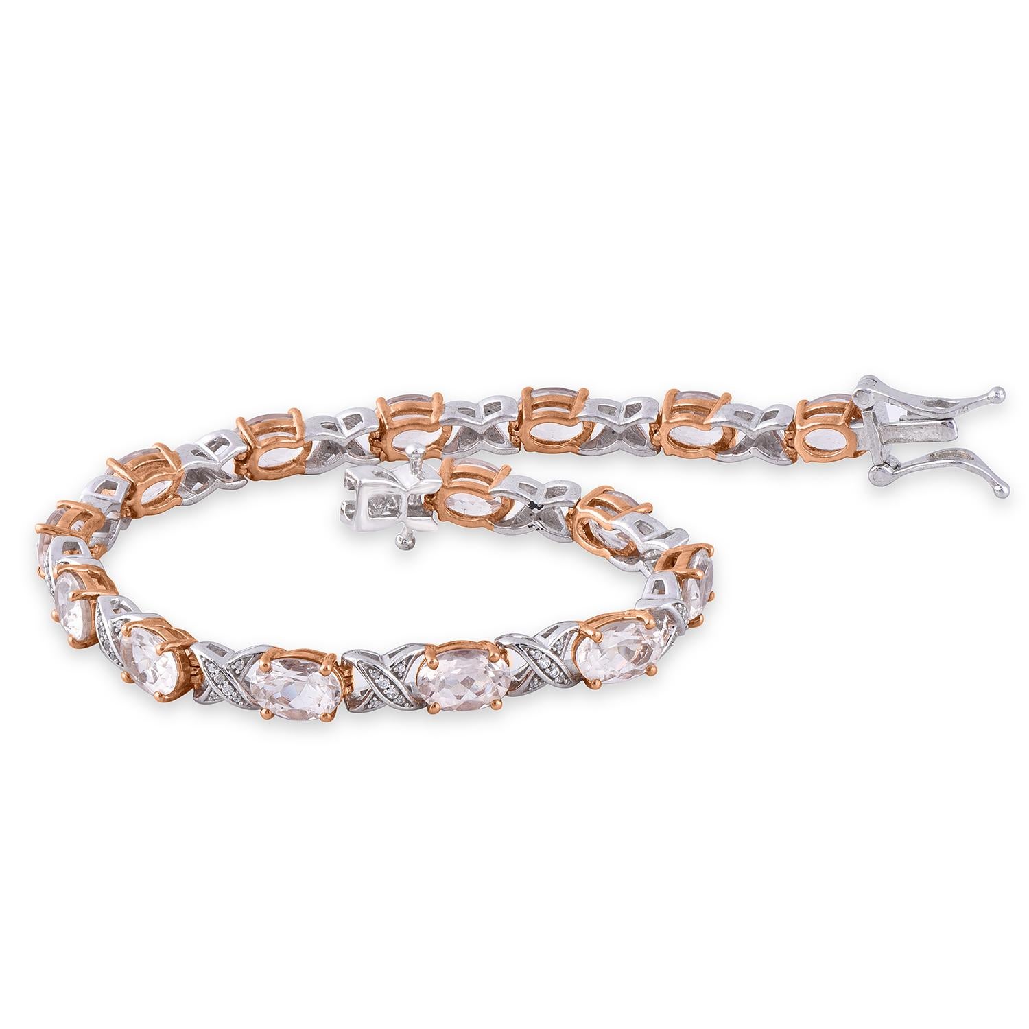 A graceful addition to her wardrobe, this diamond frame bracelet brings the perfect touch of sparkle to her look. Made by our inhouse experts in 14 karat Rose gold and studded with 90 round diamond and 15 Oval cut 7 x 5 mm Morganite Gemstones in